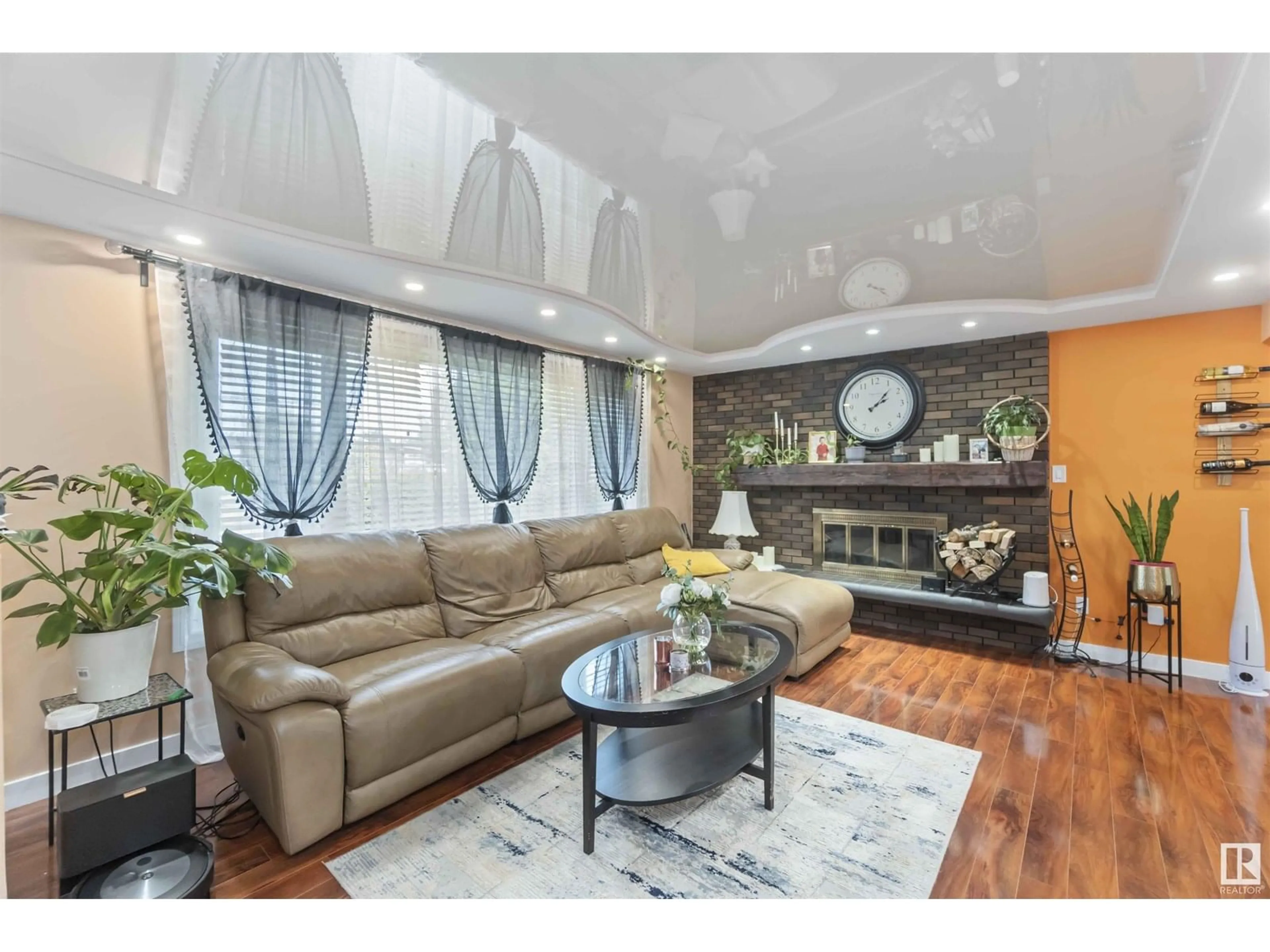Living room with furniture, wood/laminate floor for 8511 142A AV NW, Edmonton Alberta T5E2G6