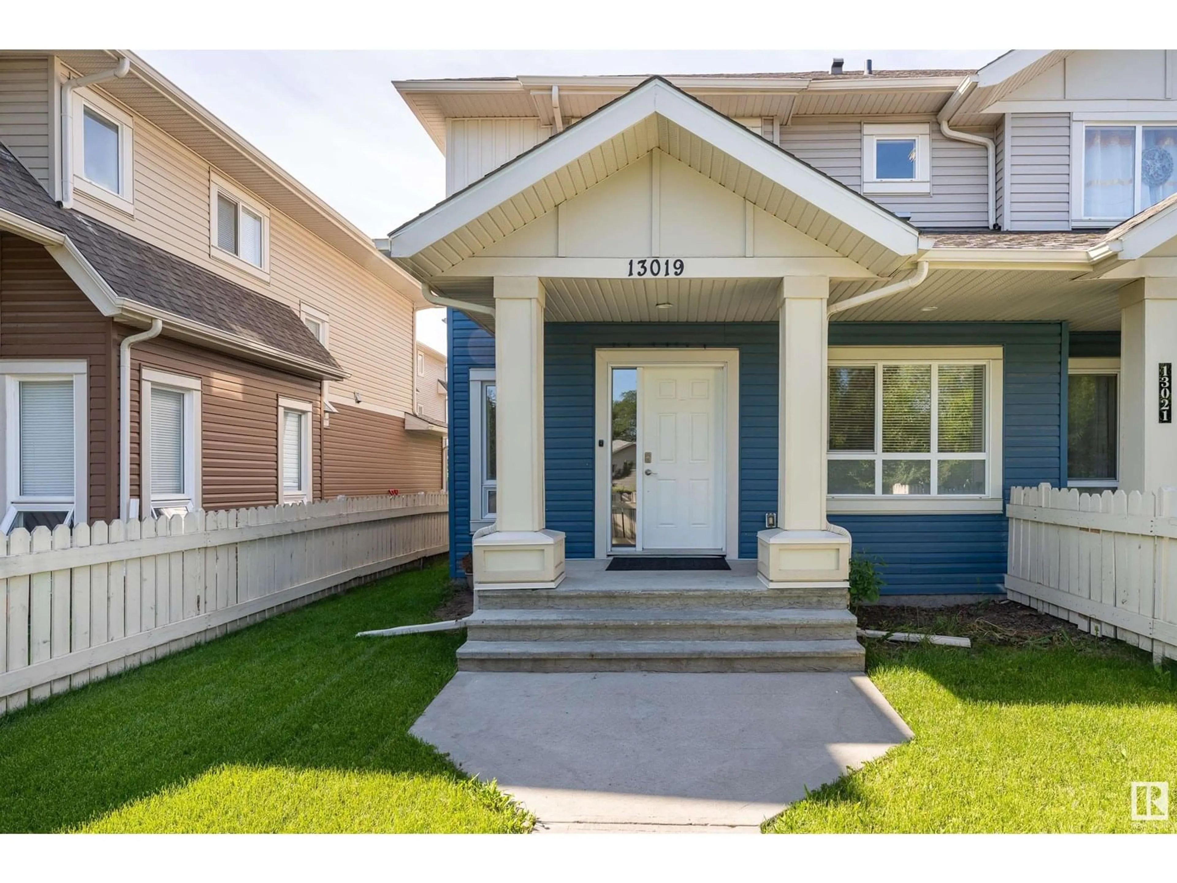 Home with vinyl exterior material, street for 13019 132 AV, Edmonton Alberta T5L3R2