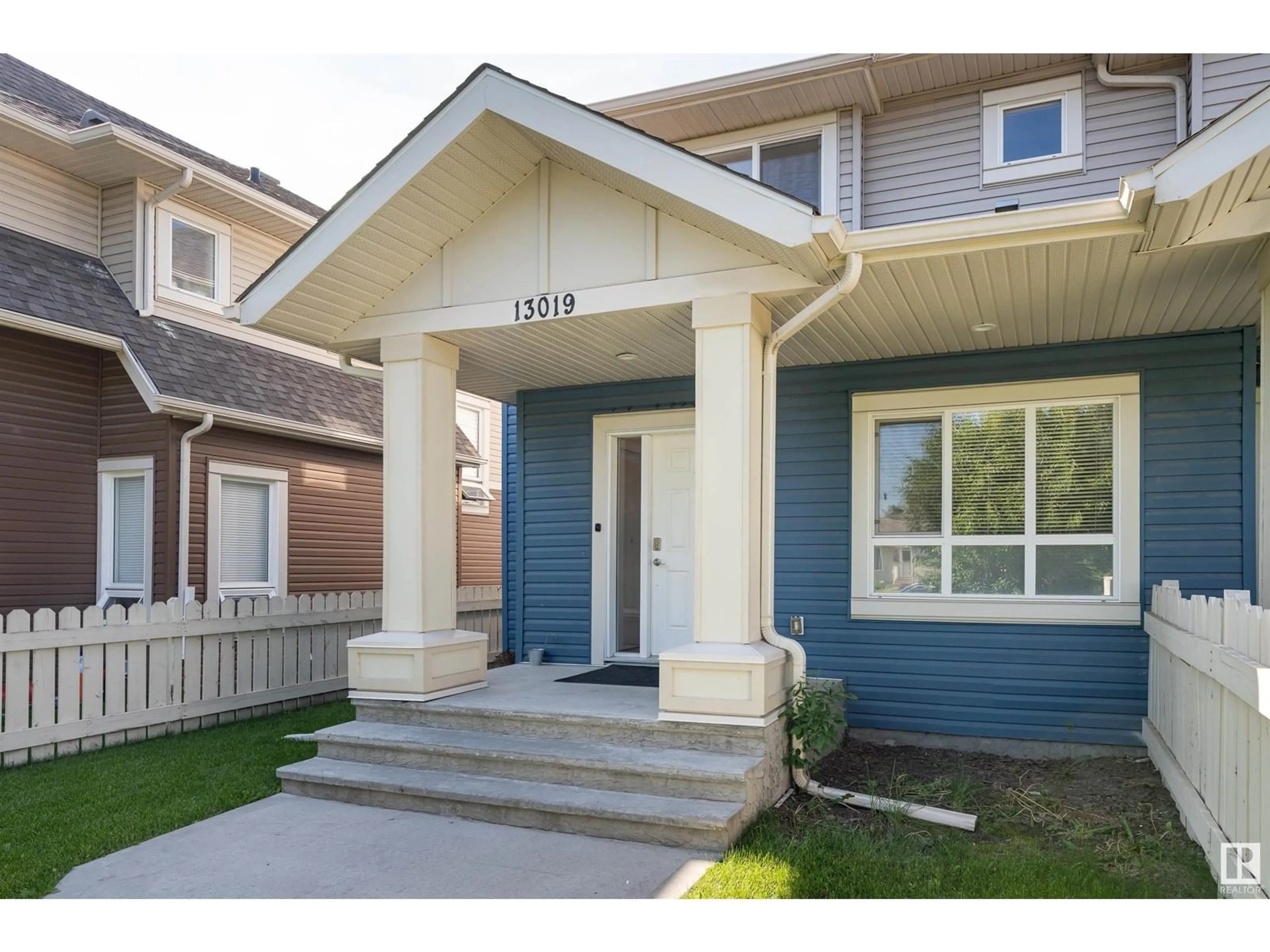 Home with vinyl exterior material, street for 13019 132 AV, Edmonton Alberta T5L3R2