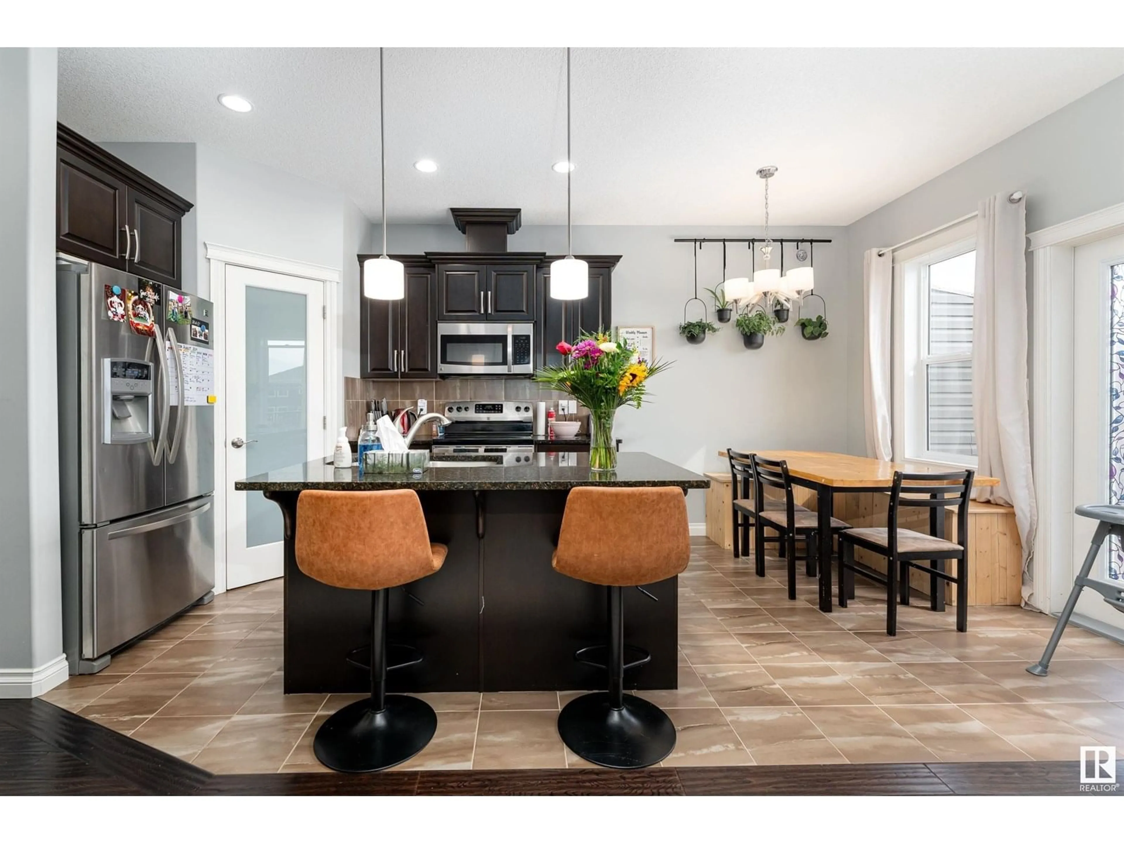 Open concept kitchen, wood/laminate floor for 39 RICHMOND LI, Fort Saskatchewan Alberta T8L0S2