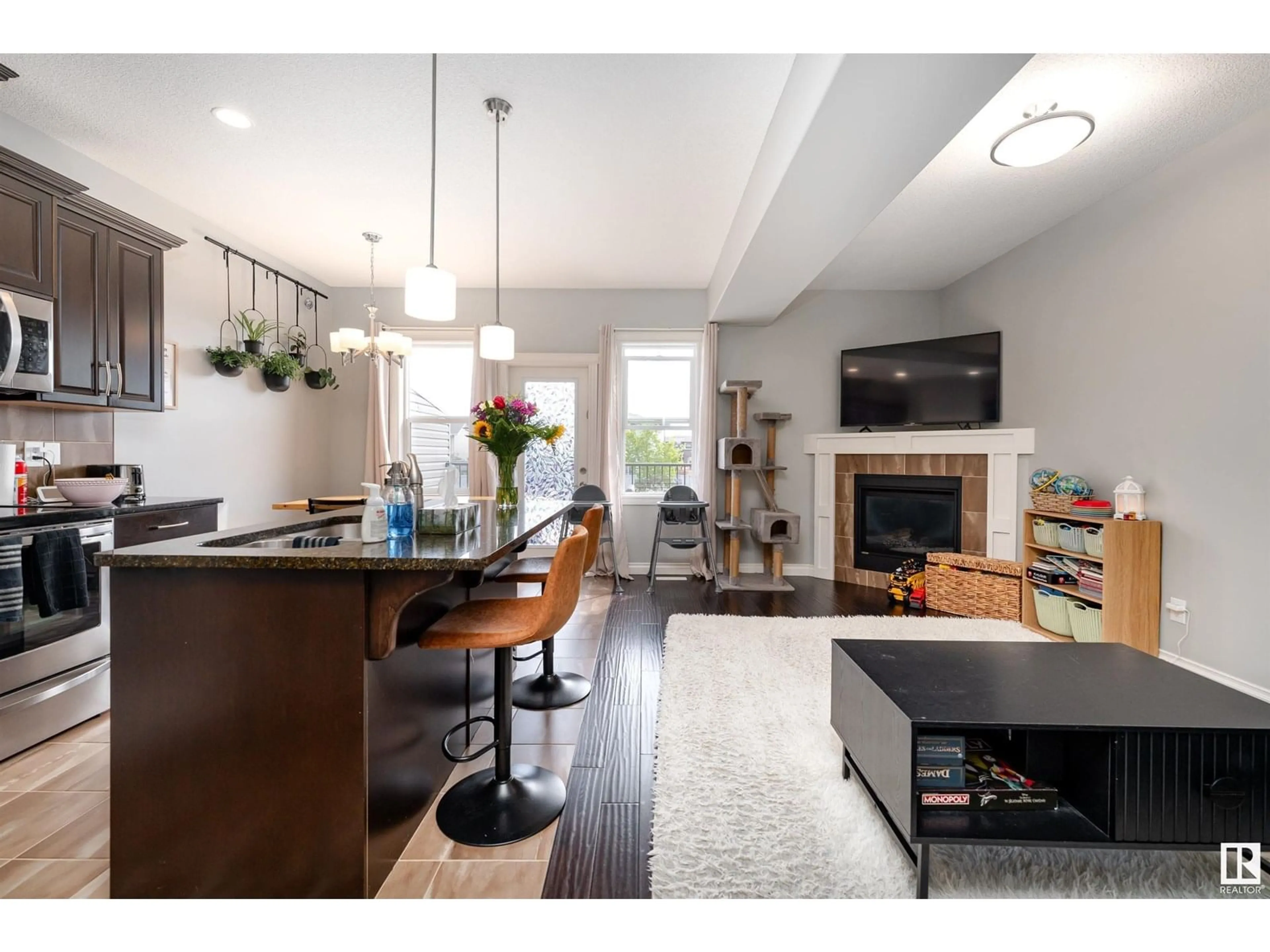Open concept kitchen, wood/laminate floor for 39 RICHMOND LI, Fort Saskatchewan Alberta T8L0S2