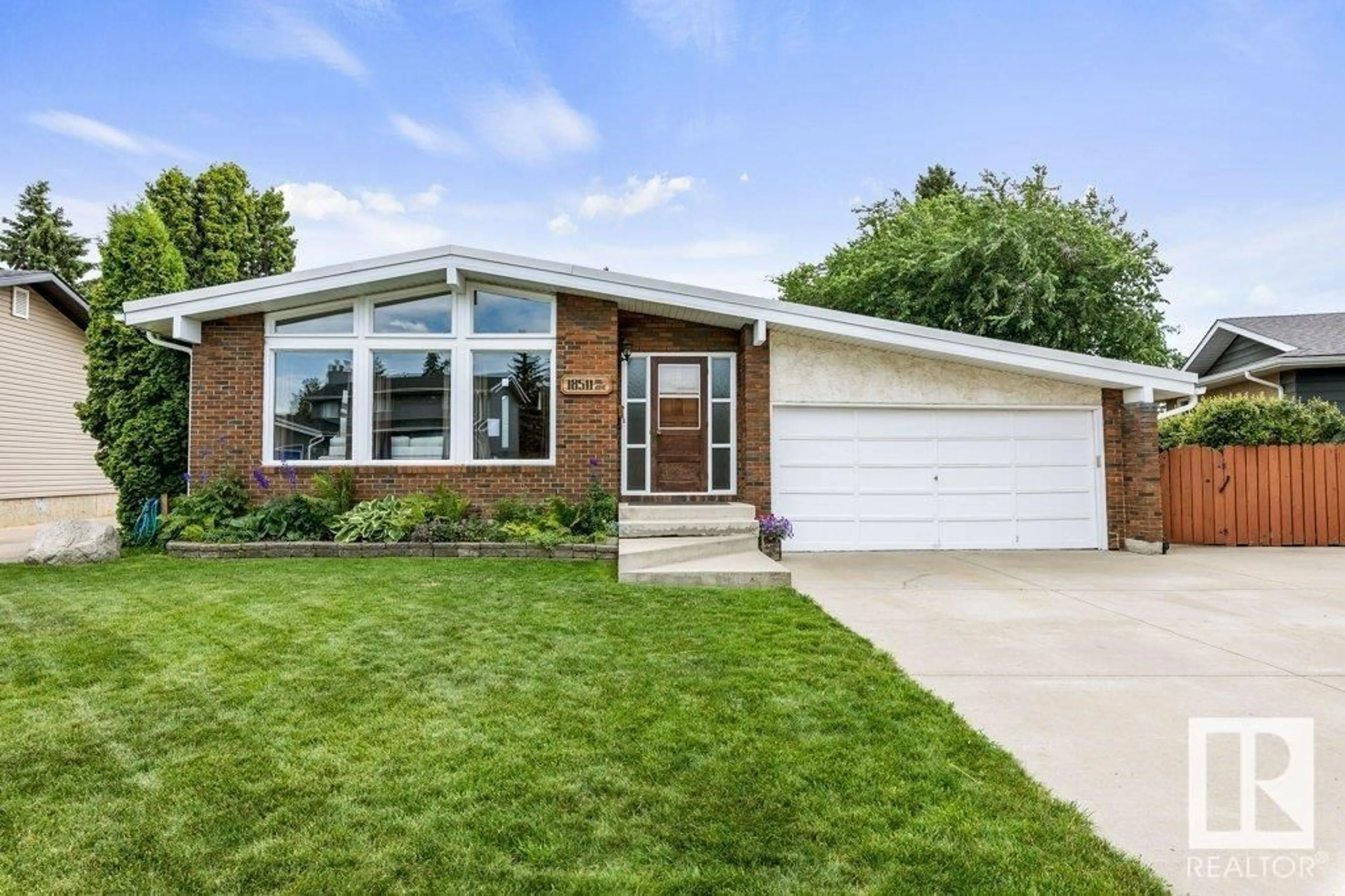 Home with vinyl exterior material, street for 18511 80 AV, Edmonton Alberta T5T1E8