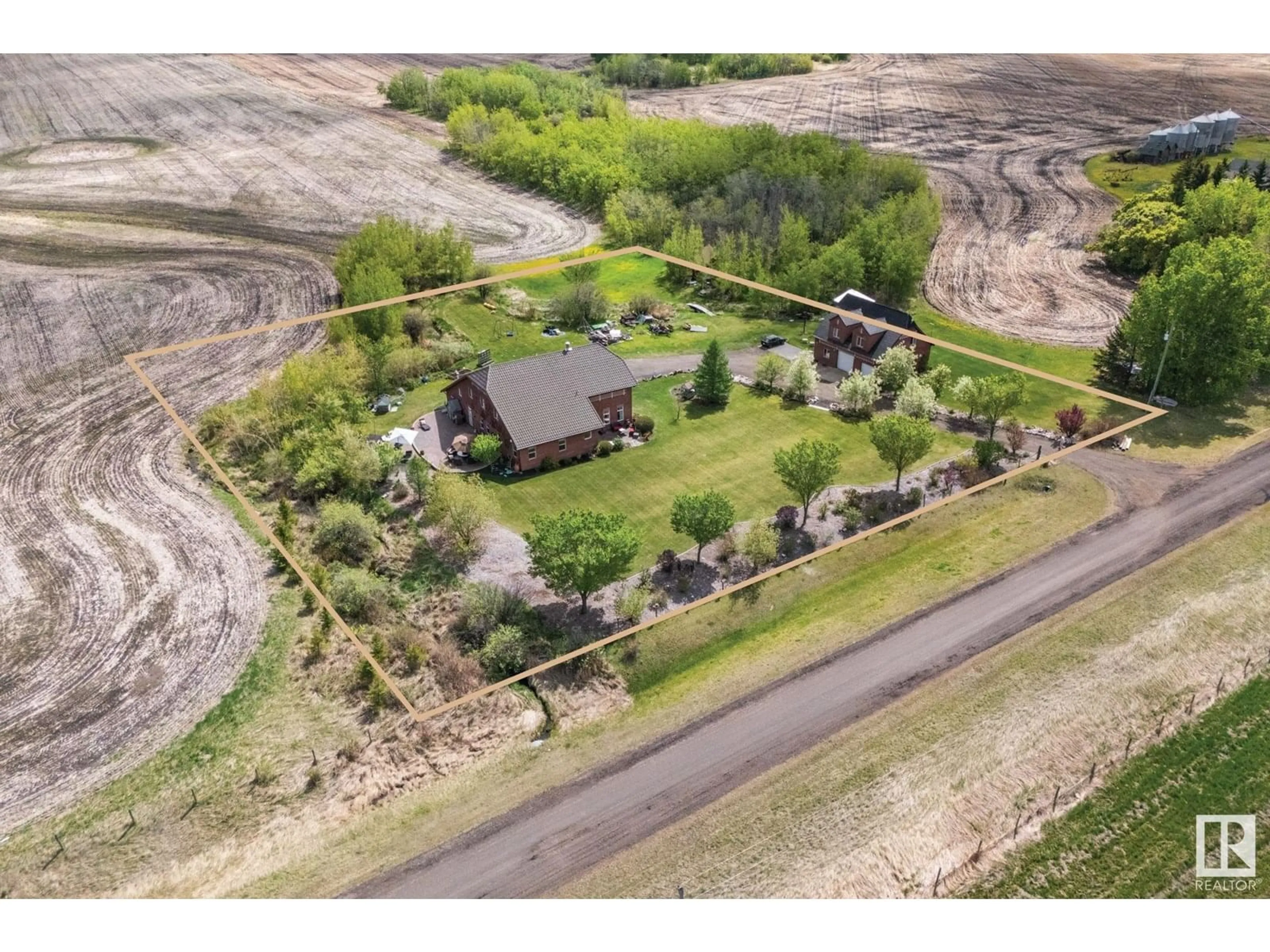 A pic from outside/outdoor area/front of a property/back of a property/a pic from drone, unknown for 53341 HWY 21, Rural Strathcona County Alberta T8A4V1