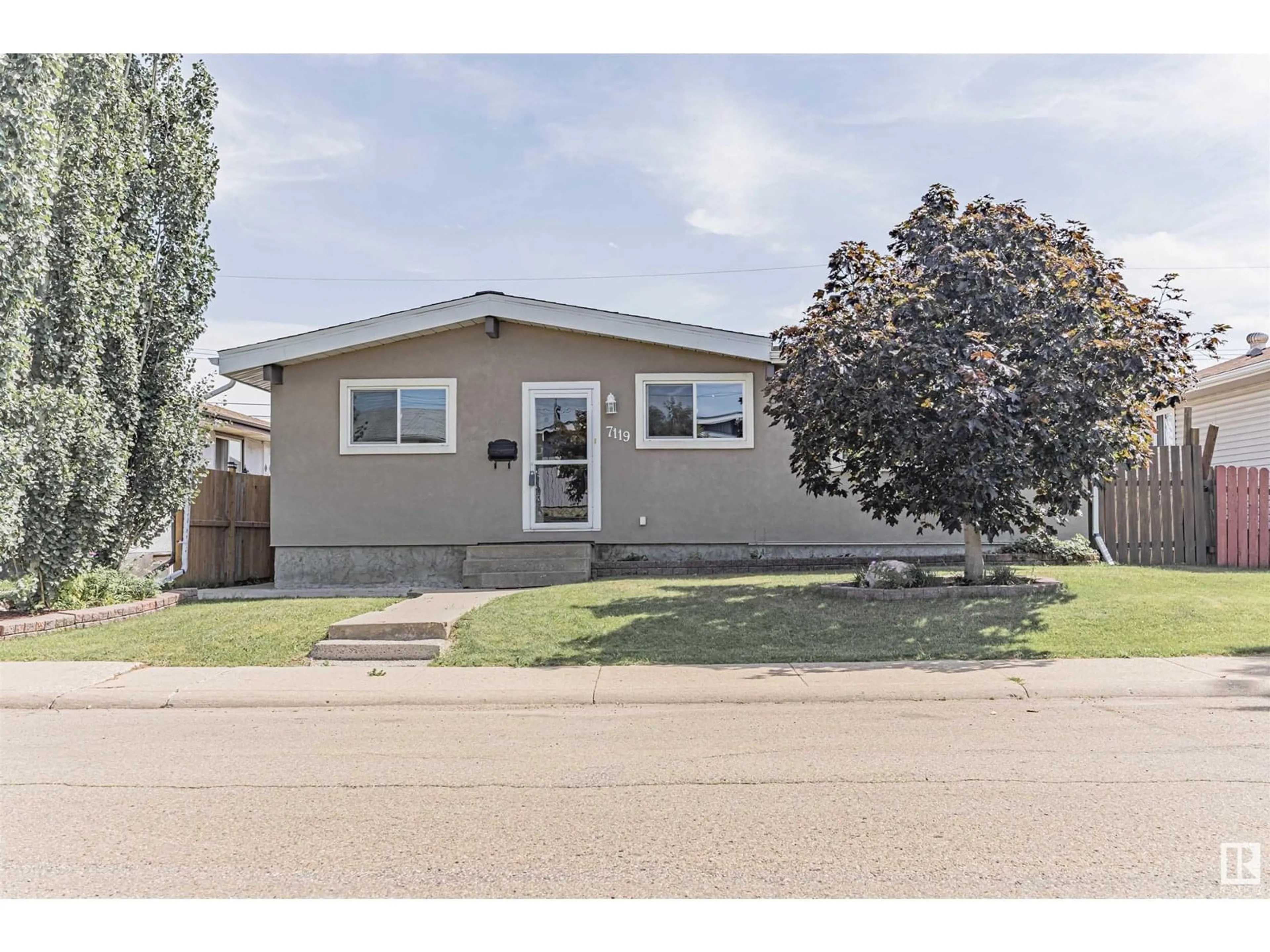Home with vinyl exterior material, street for 7119 136 AV, Edmonton Alberta T5C2K3