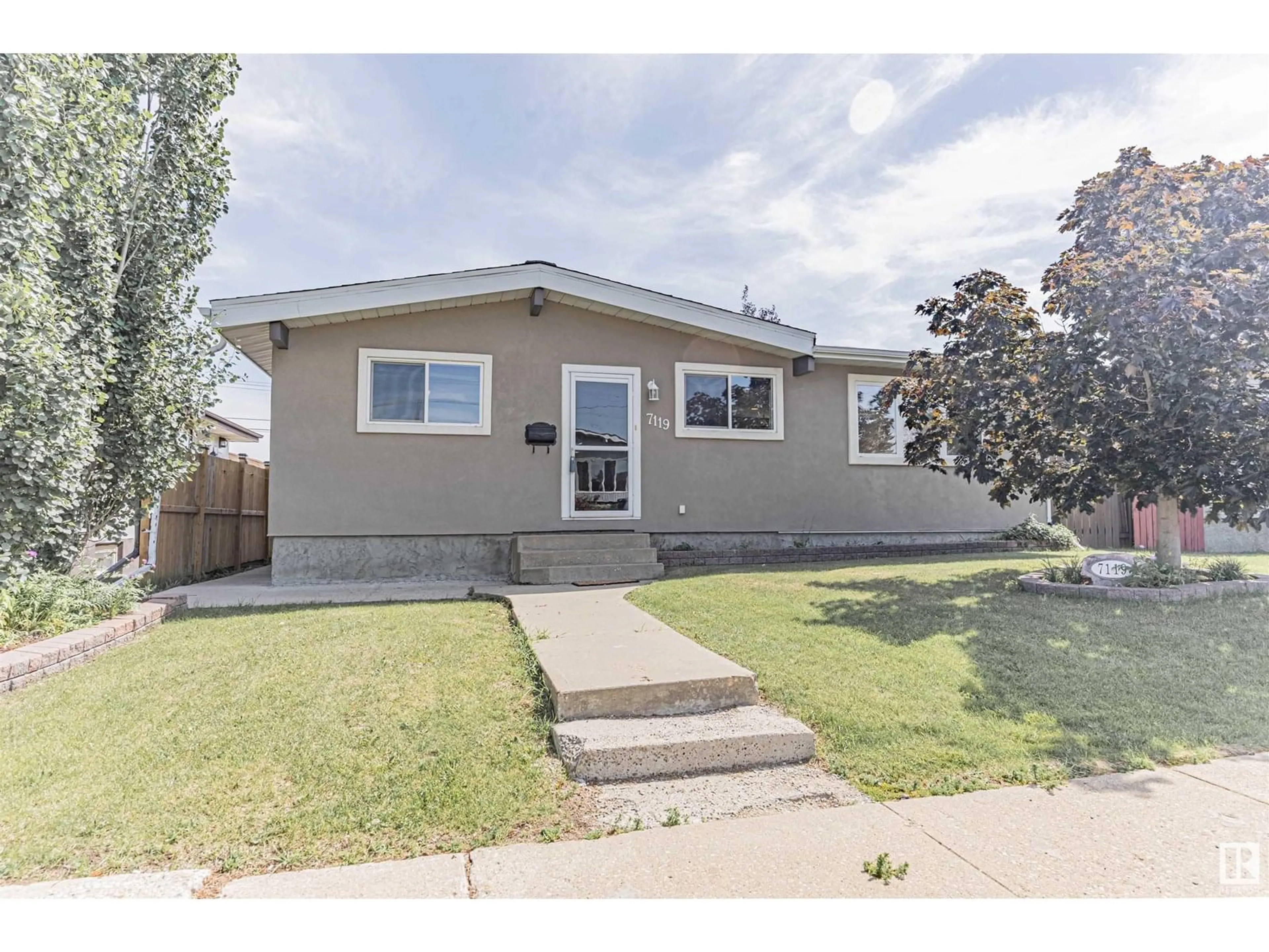 Home with vinyl exterior material, street for 7119 136 AV, Edmonton Alberta T5C2K3