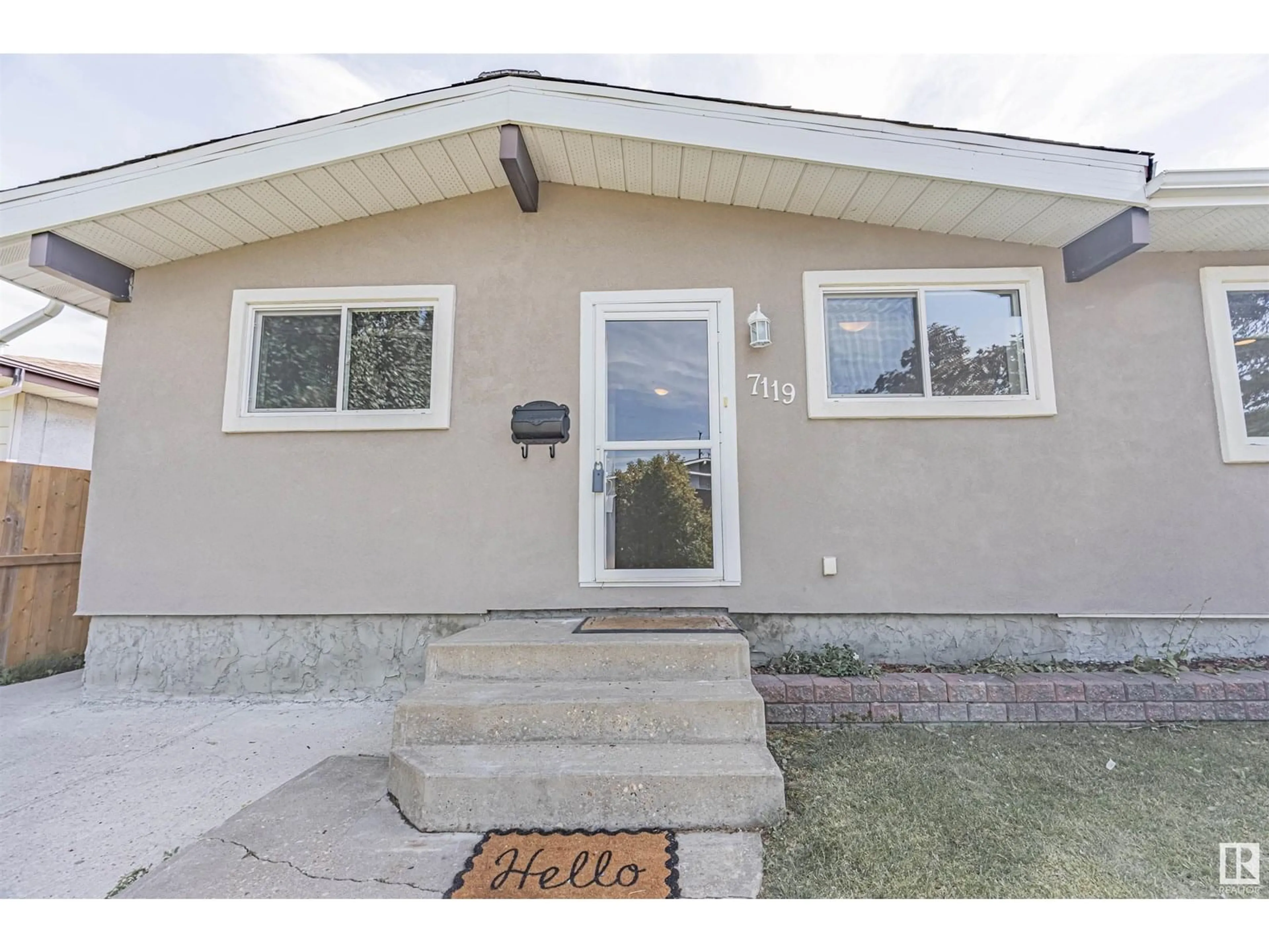 Home with vinyl exterior material, street for 7119 136 AV, Edmonton Alberta T5C2K3