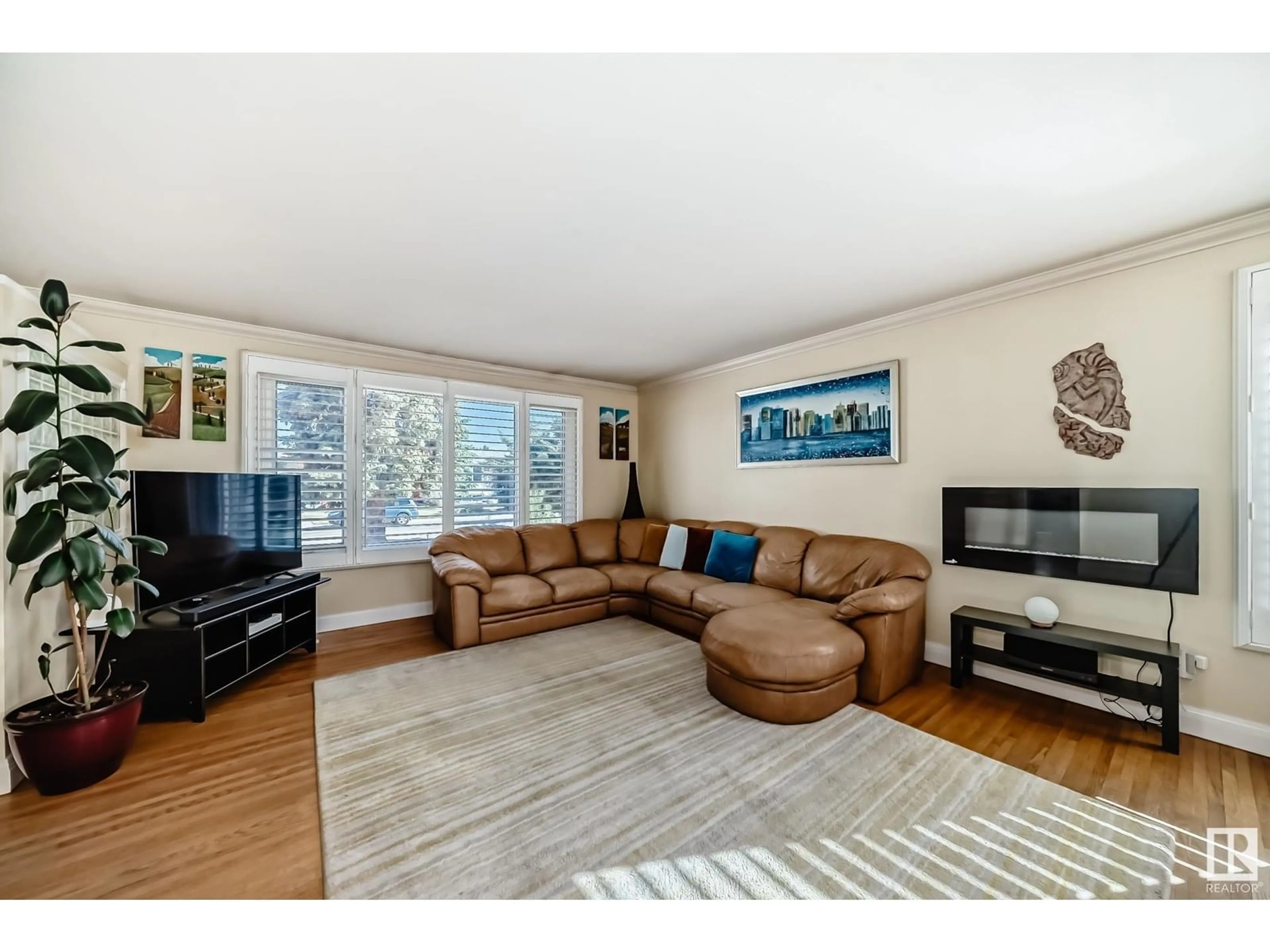 Living room with furniture, wood/laminate floor for 11731 38A AV, Edmonton Alberta T6J0L8
