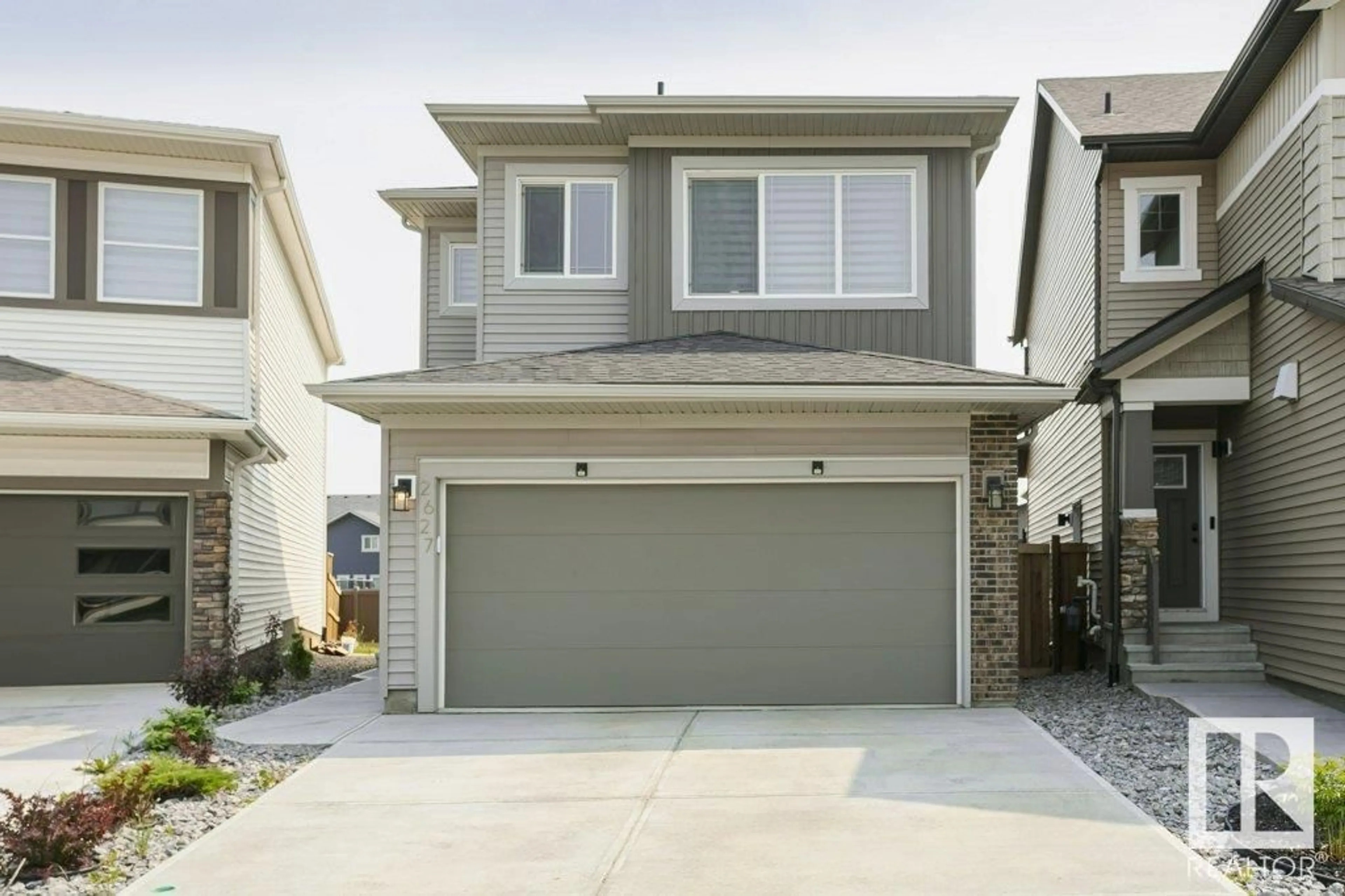 Home with vinyl exterior material, street for NW - 2627 200 ST, Edmonton Alberta T6M1K3