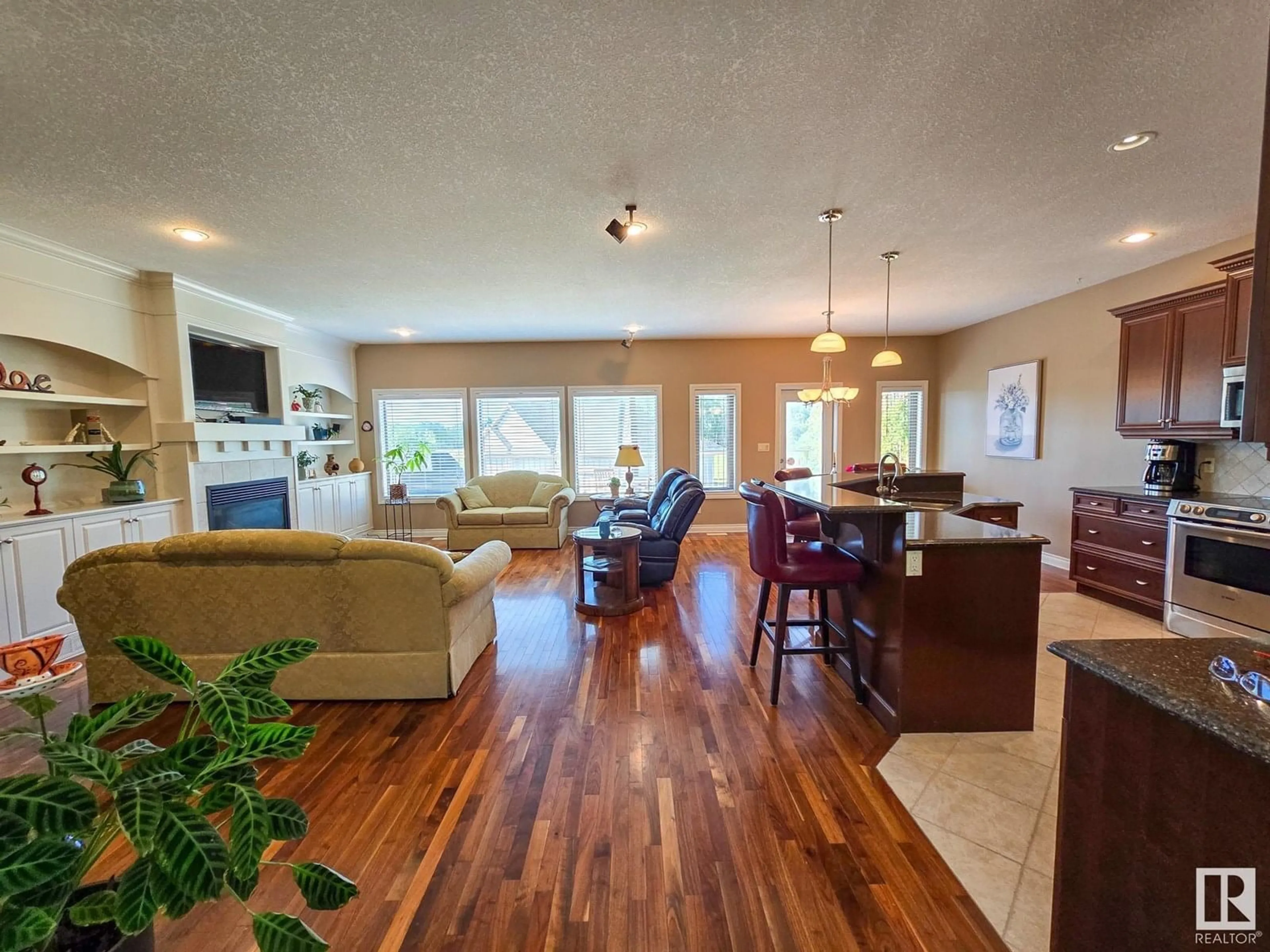 Living room with furniture, wood/laminate floor for #3 - 53105 RGE ROAD 15, Rural Parkland County Alberta T7Y2E4