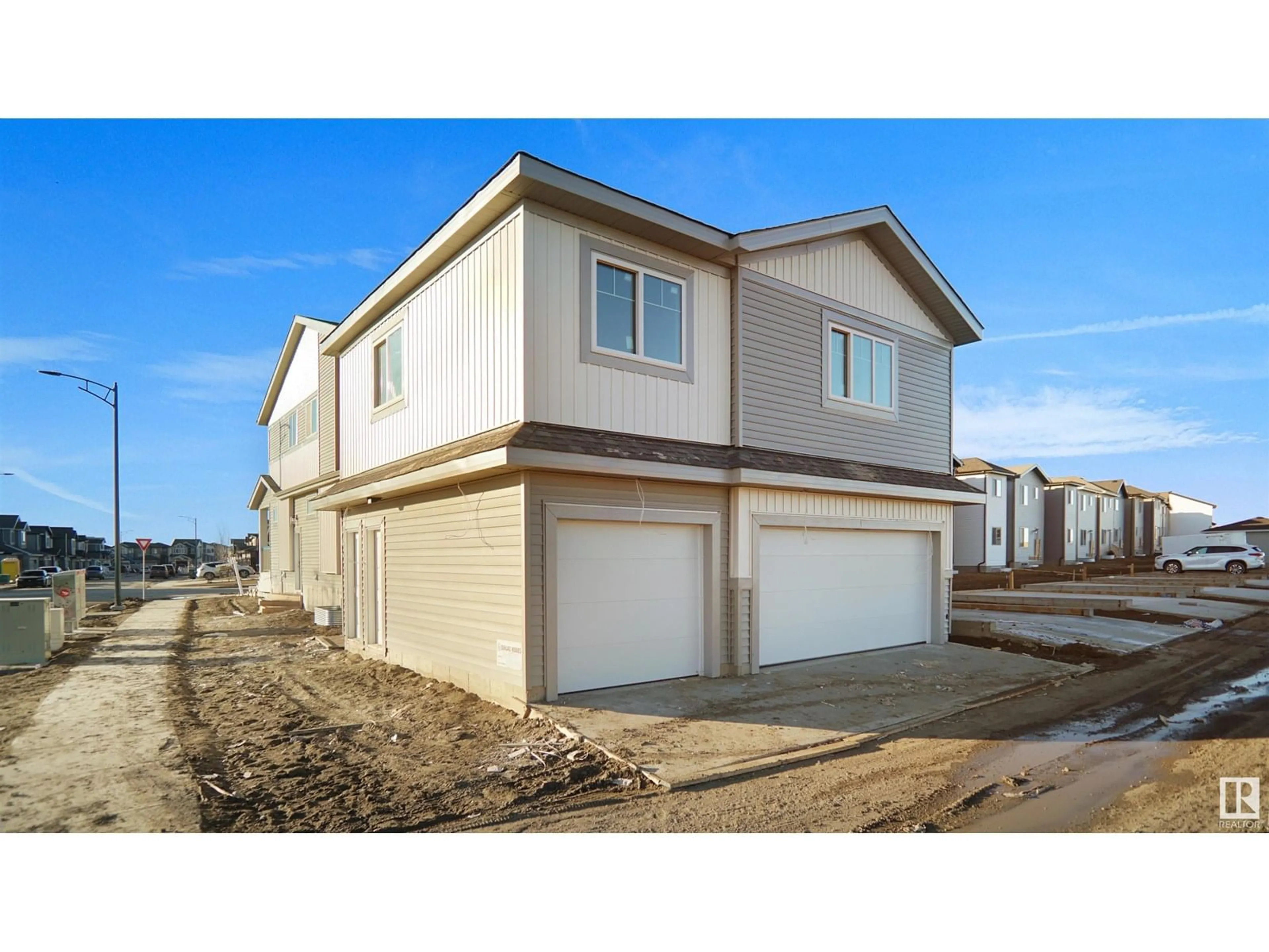 Home with vinyl exterior material, street for 703 MATTSON DR, Edmonton Alberta T6X3G3