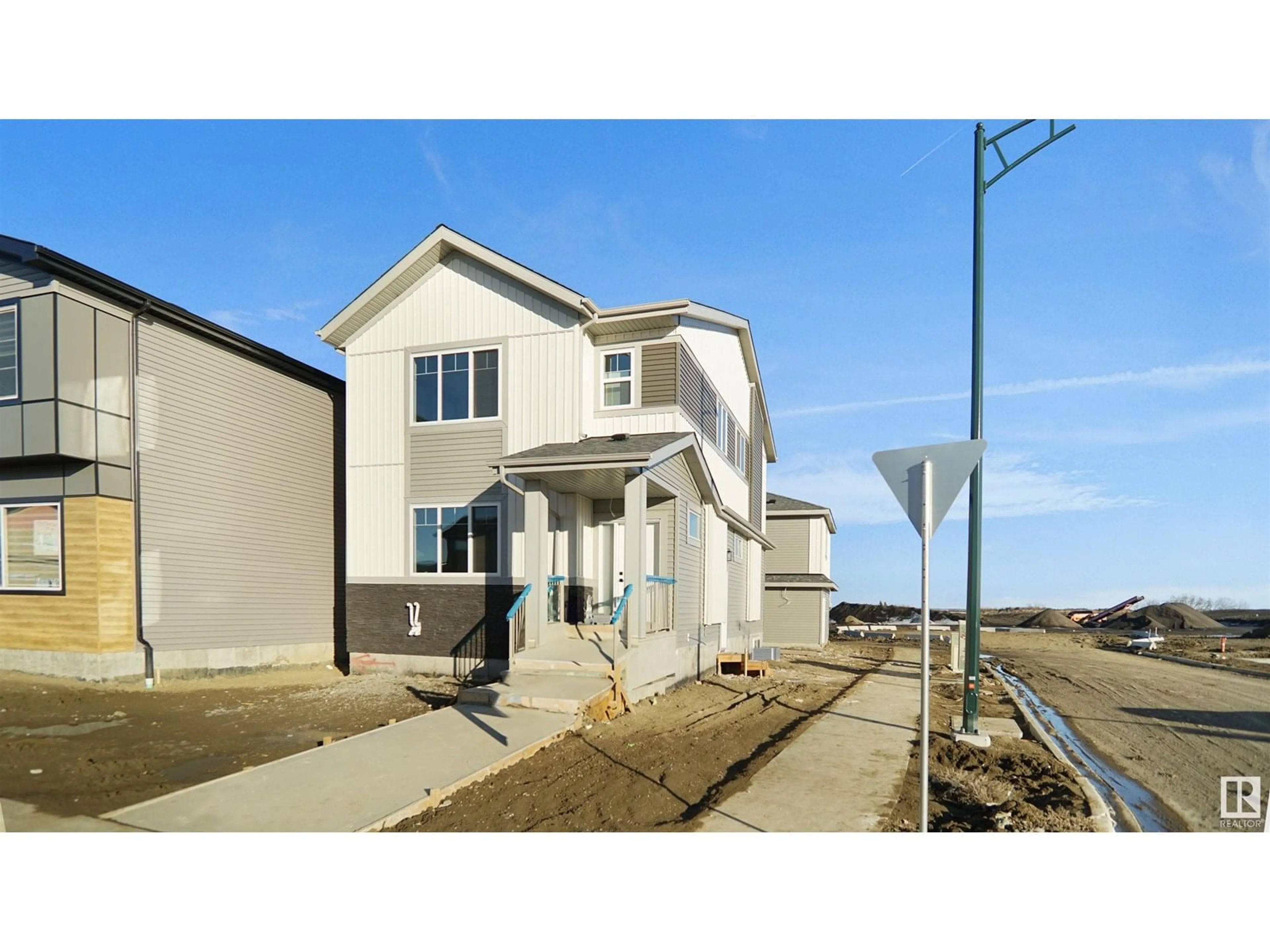 Home with vinyl exterior material, street for 703 MATTSON DR, Edmonton Alberta T6X3G3