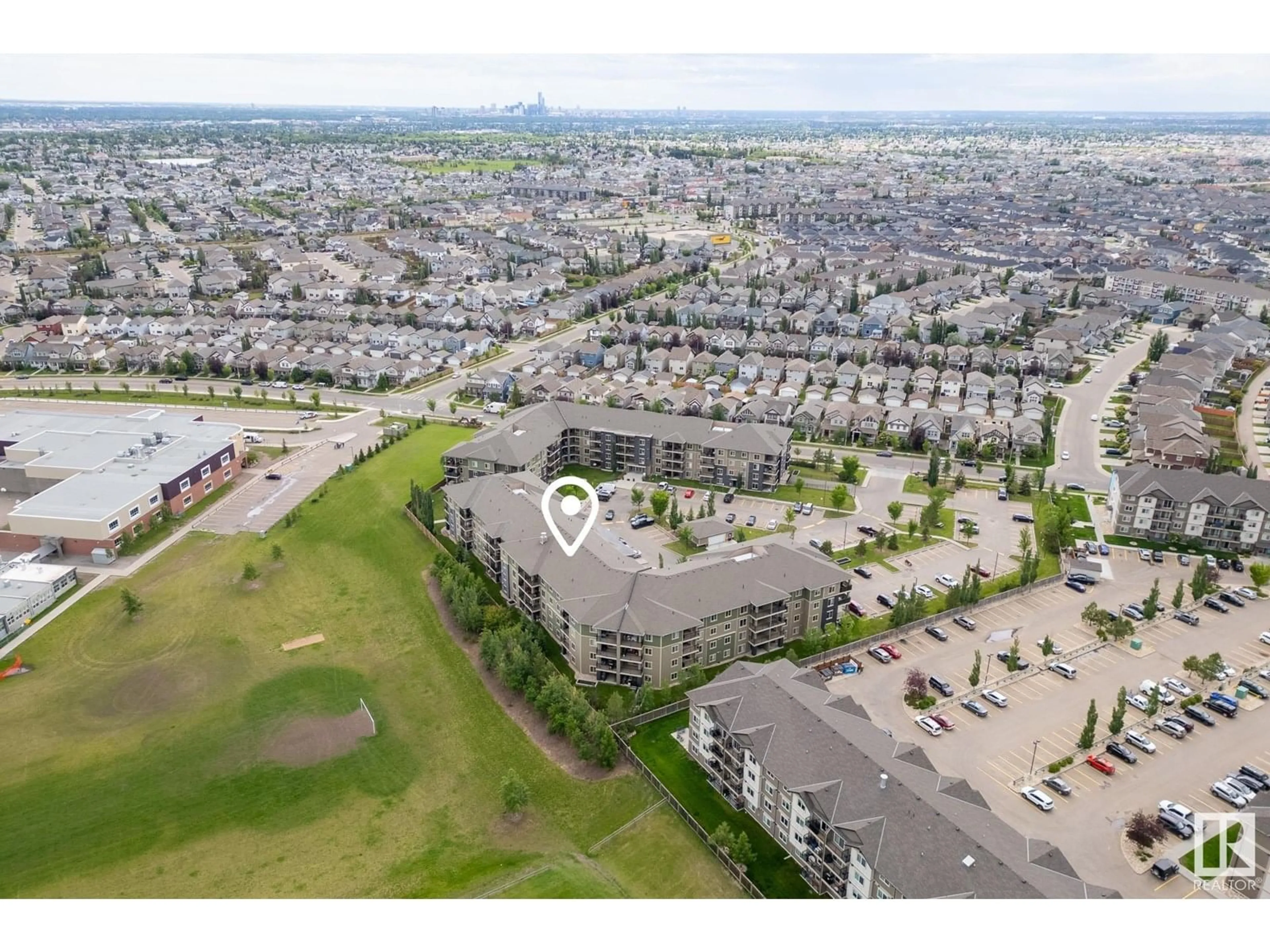 A pic from outside/outdoor area/front of a property/back of a property/a pic from drone, unknown for #406 - 274 MCCONACHIE DR, Edmonton Alberta T5Y3N4
