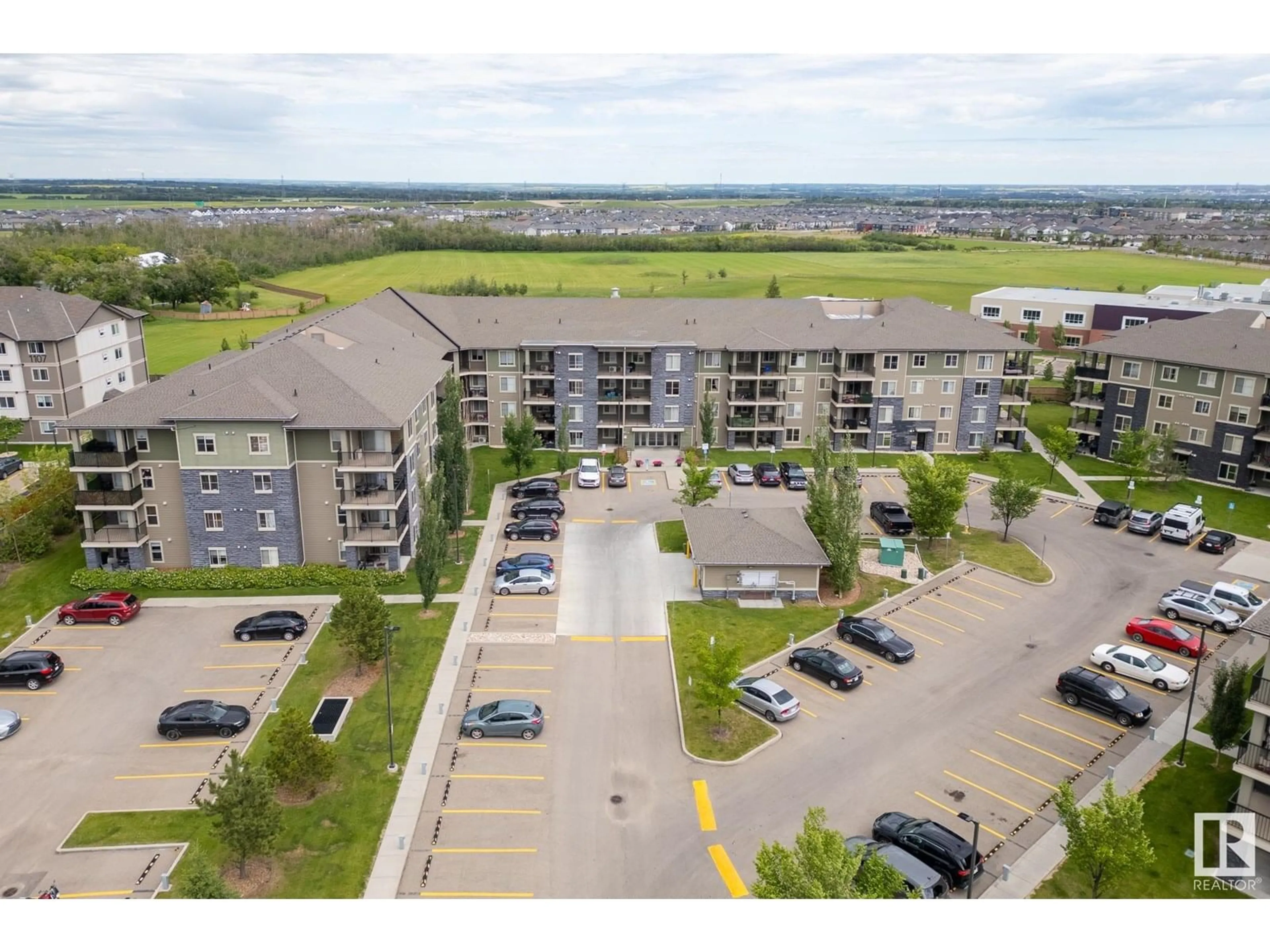 A pic from outside/outdoor area/front of a property/back of a property/a pic from drone, unknown for #406 - 274 MCCONACHIE DR, Edmonton Alberta T5Y3N4