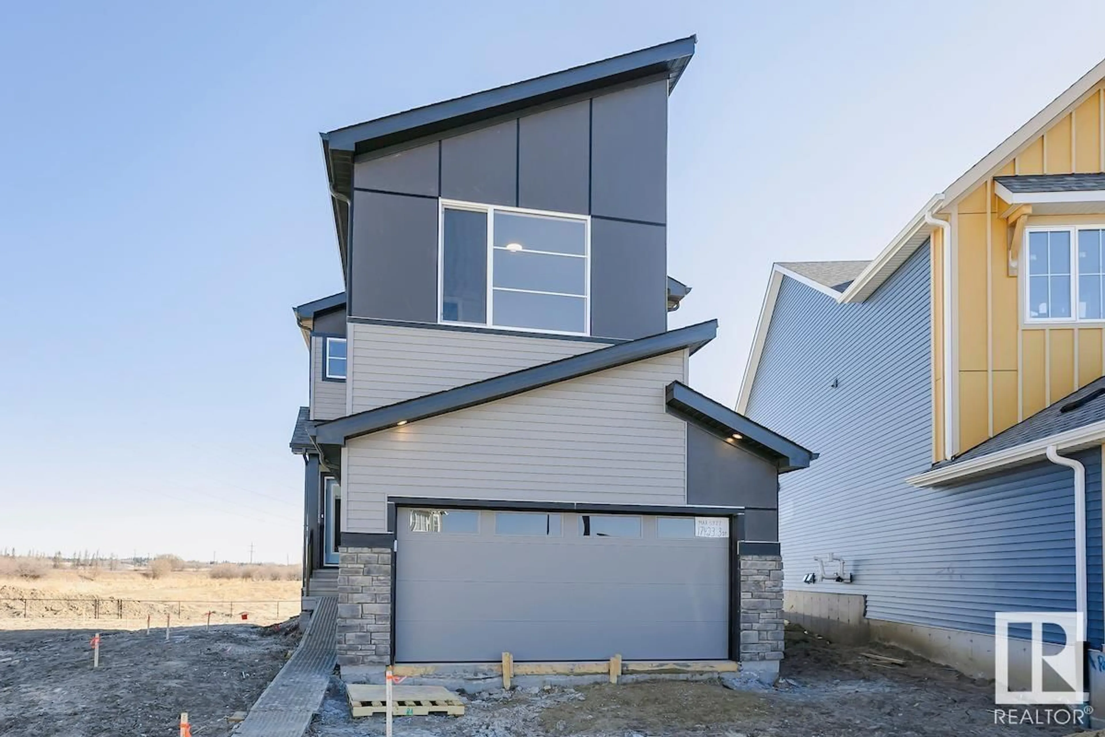 Home with vinyl exterior material, street for NW - 17423 3 ST, Edmonton Alberta T5Y4G7