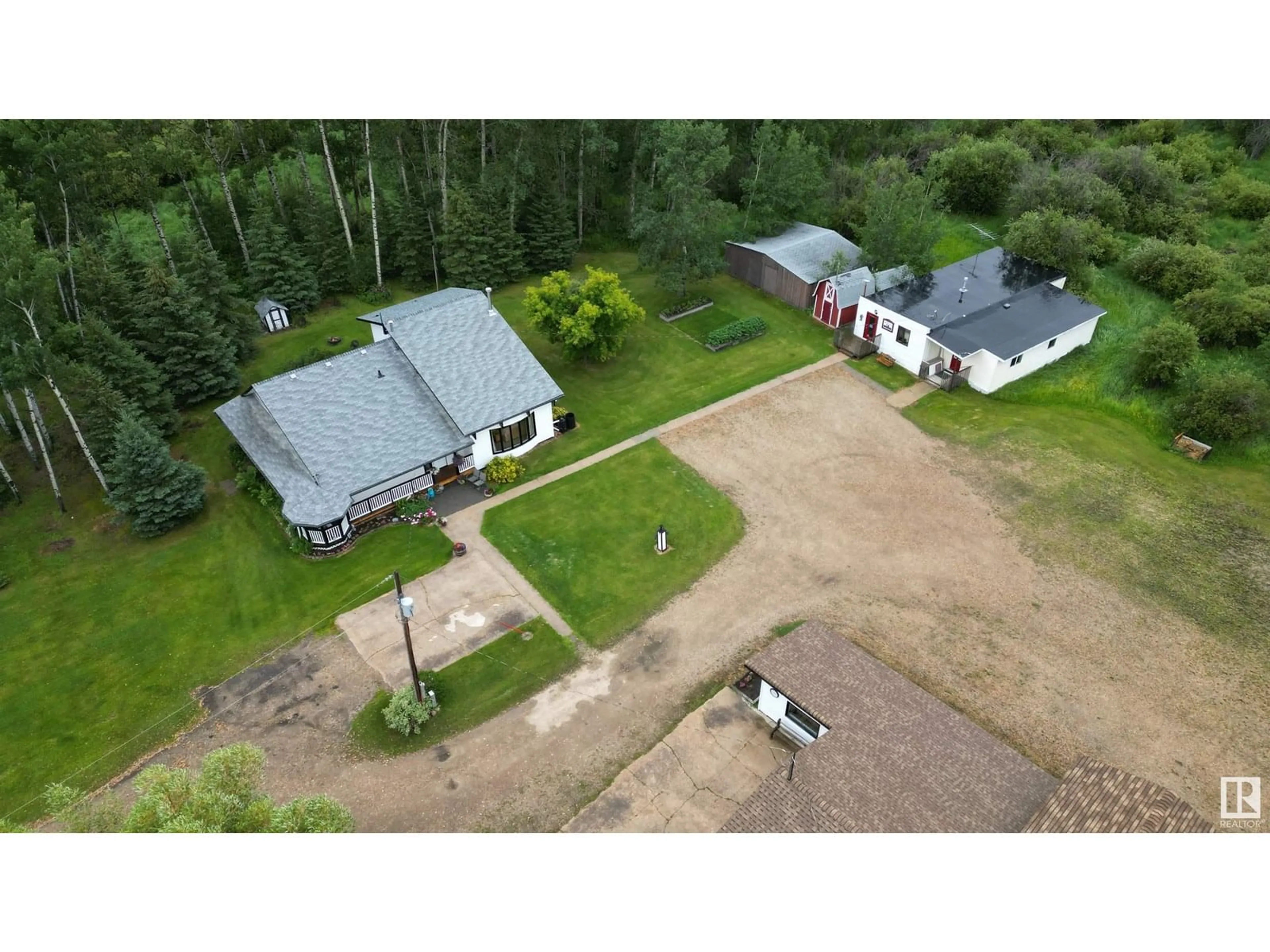 A pic from outside/outdoor area/front of a property/back of a property/a pic from drone, unknown for 8125 HWY 18, Rural Lac Ste. Anne County Alberta T0E1N0