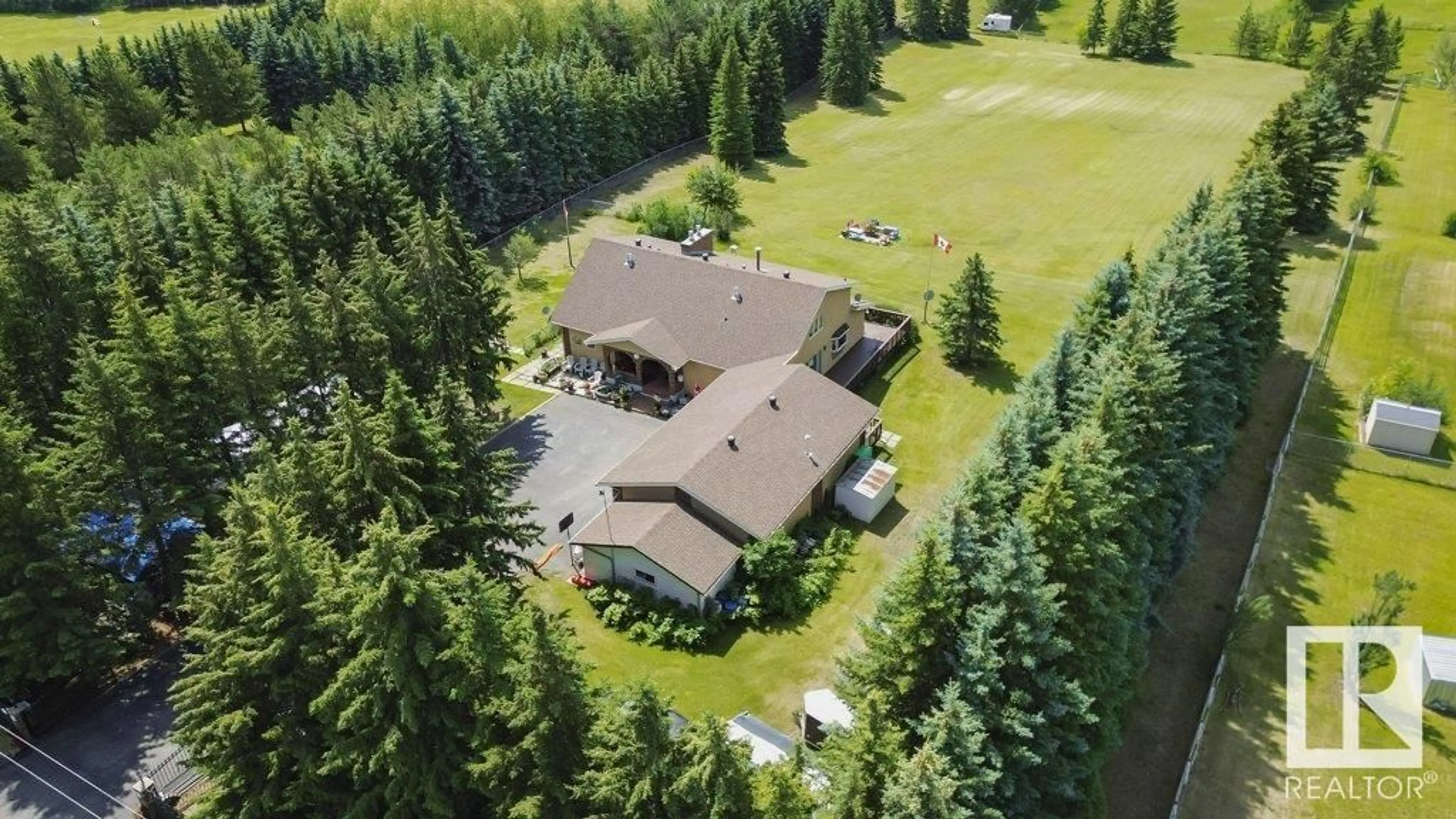 A pic from outside/outdoor area/front of a property/back of a property/a pic from drone, forest/trees view for 53310 - 229 RGE ROAD 221, Rural Strathcona County Alberta T8E2L1