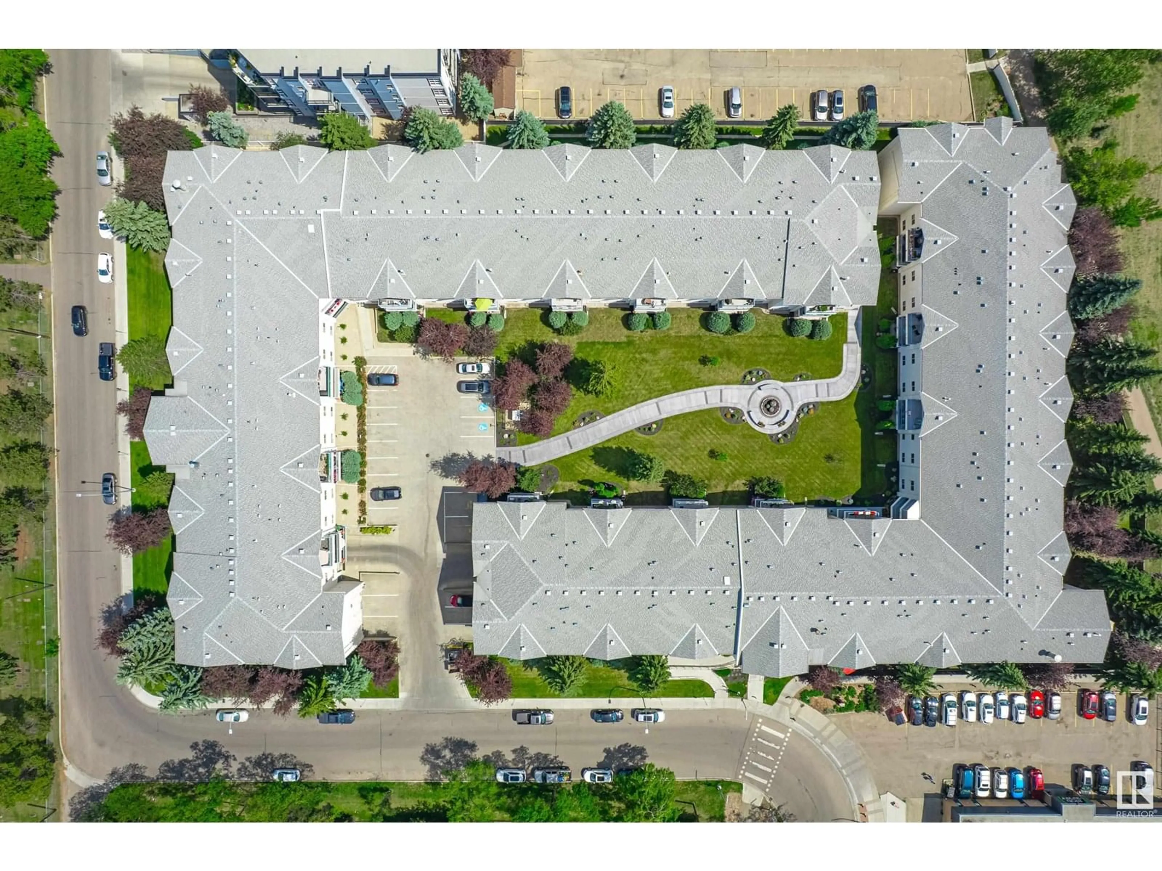 A pic from outside/outdoor area/front of a property/back of a property/a pic from drone, street for 207 - 11915 106 AV NW, Edmonton Alberta T5H0S2
