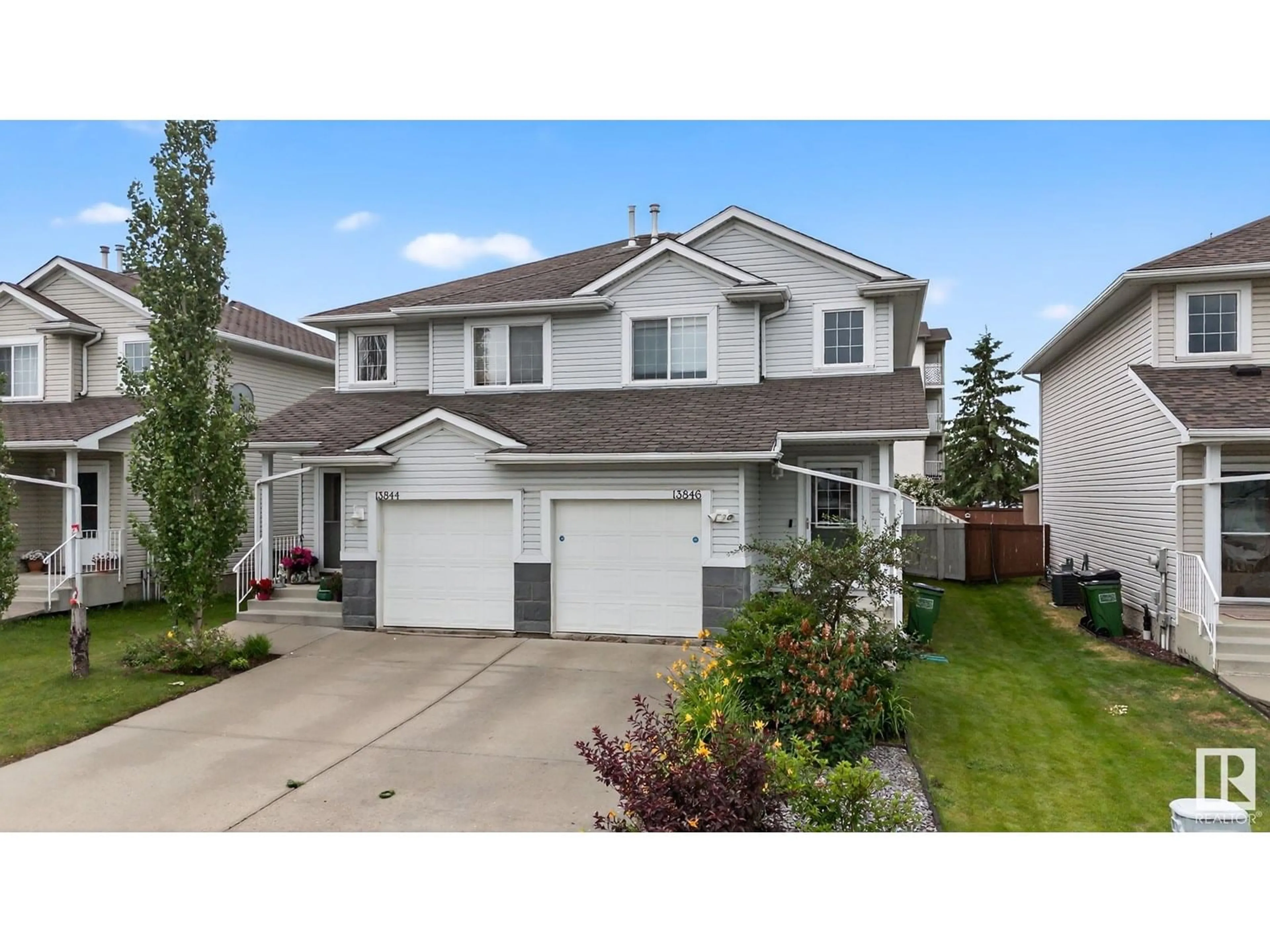 Home with vinyl exterior material, street for 13846 37 ST, Edmonton Alberta T5Y3G4