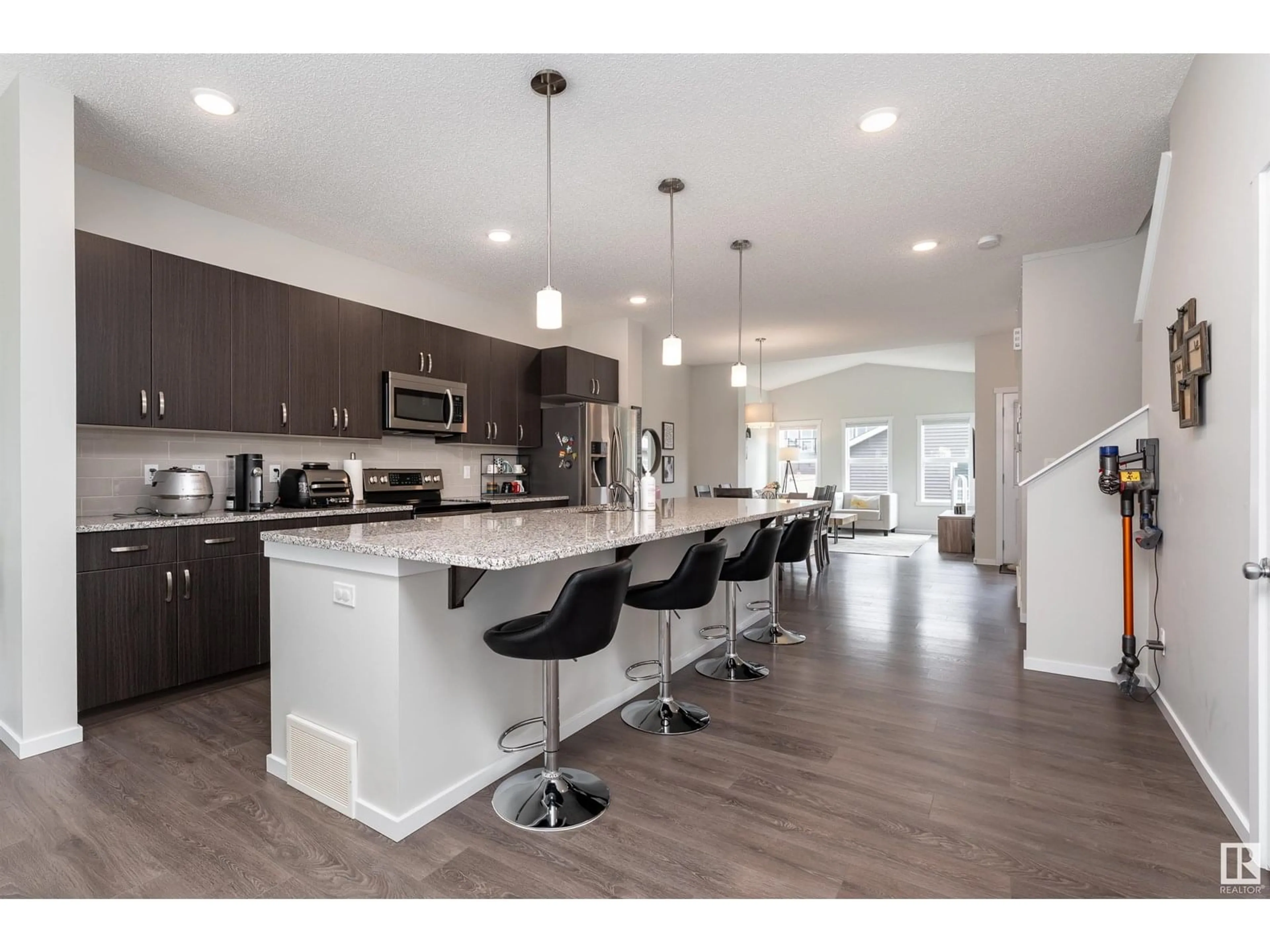 Open concept kitchen, wood/laminate floor for 345 ORCHARDS BV, Edmonton Alberta T6X1Y9