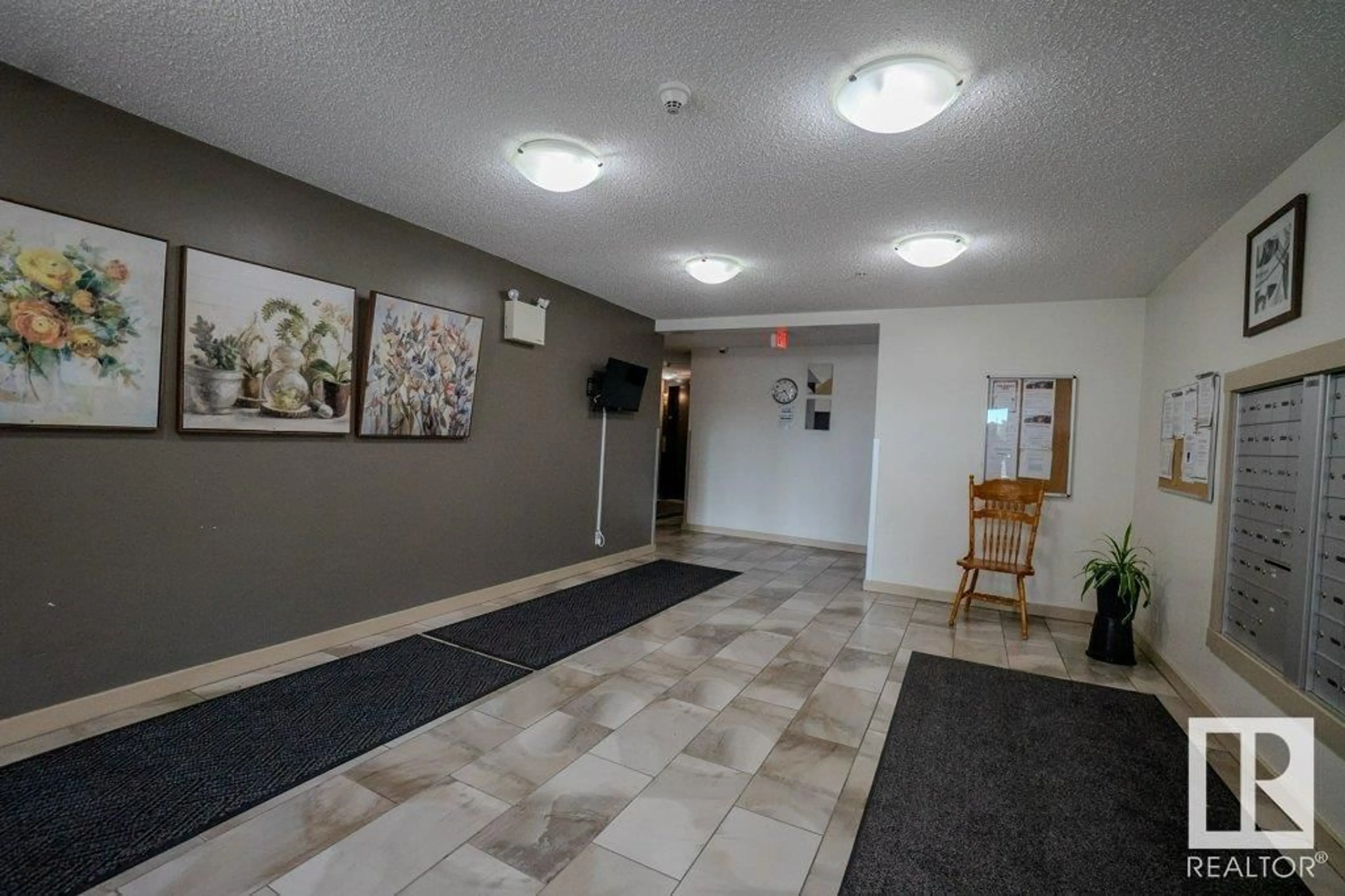 Indoor foyer for #110 - 5816 MULLEN PL, Edmonton Alberta T6R0W3