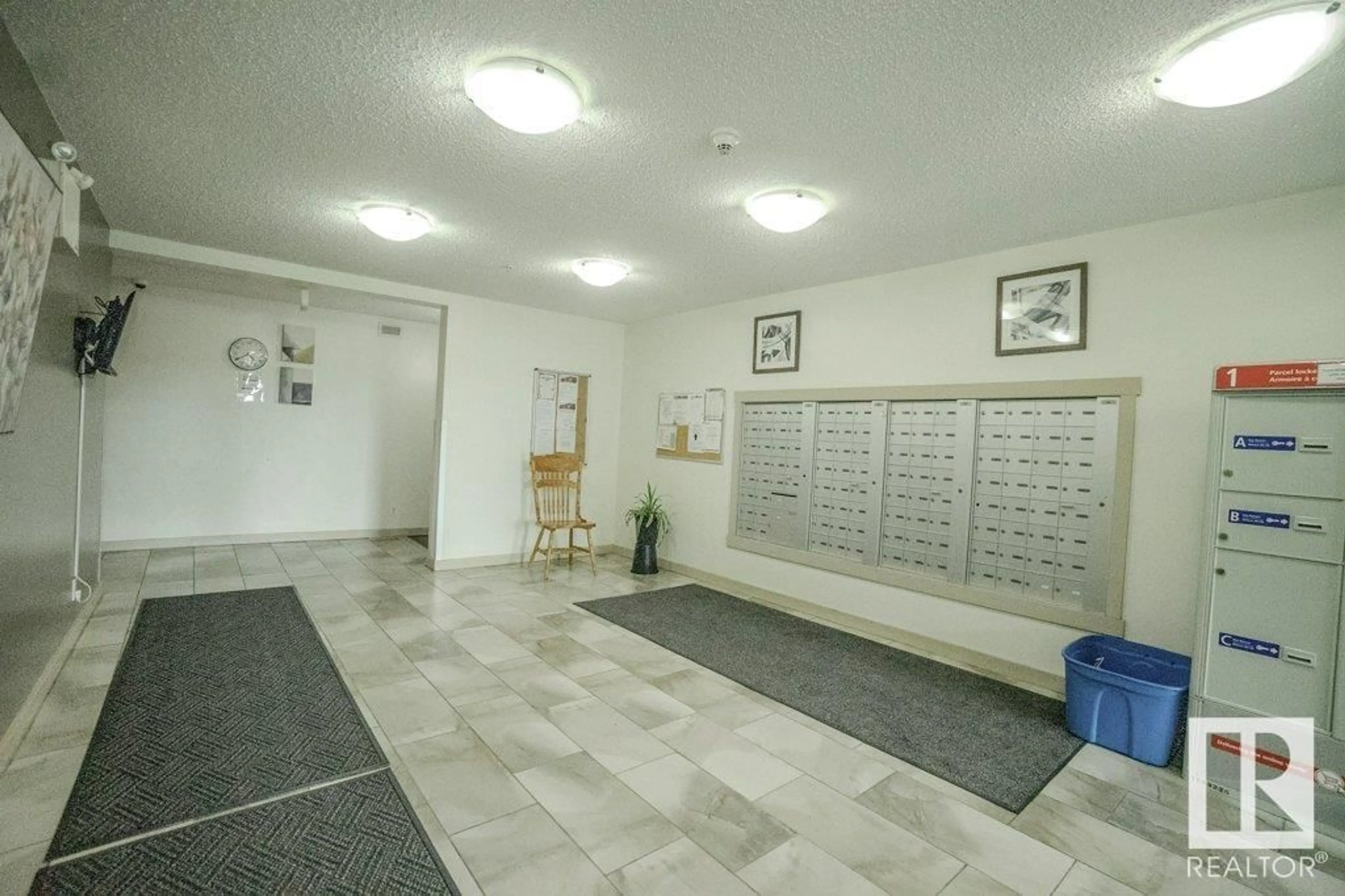 Indoor foyer for #110 - 5816 MULLEN PL, Edmonton Alberta T6R0W3