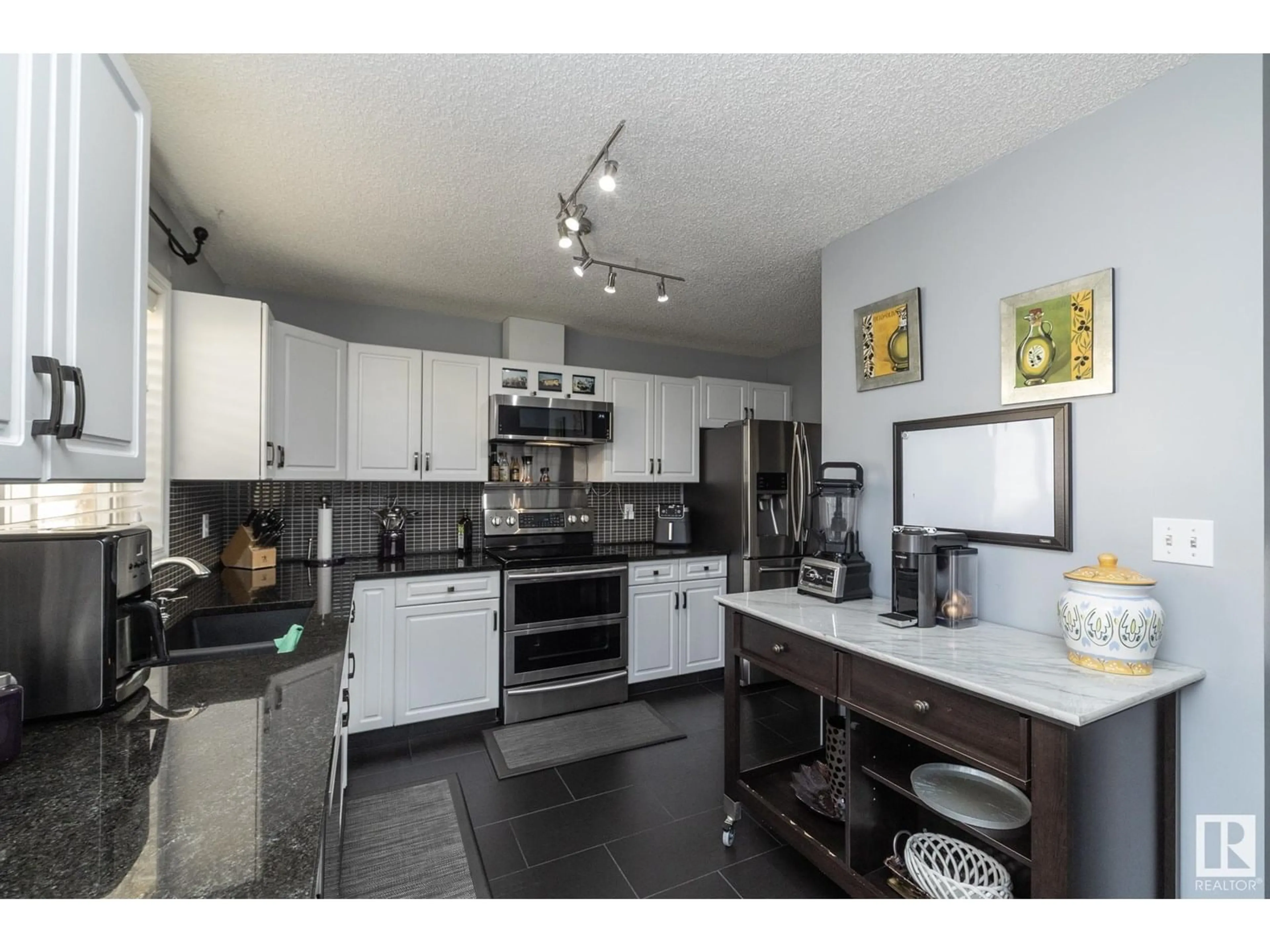 Open concept kitchen, unknown for #31 - 11717 9B AV, Edmonton Alberta T6J7B7
