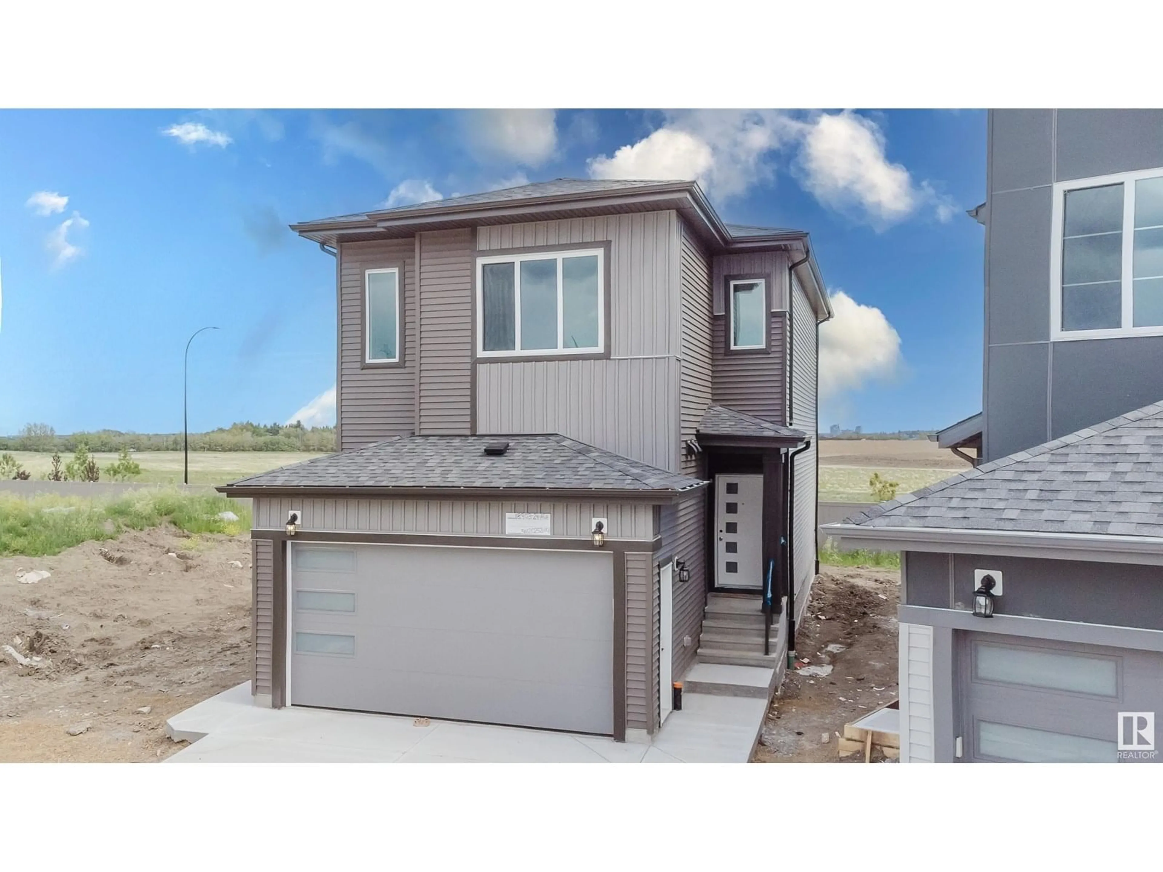 Home with vinyl exterior material, street for NW - 18903 24 AV, Edmonton Alberta T6M3H9