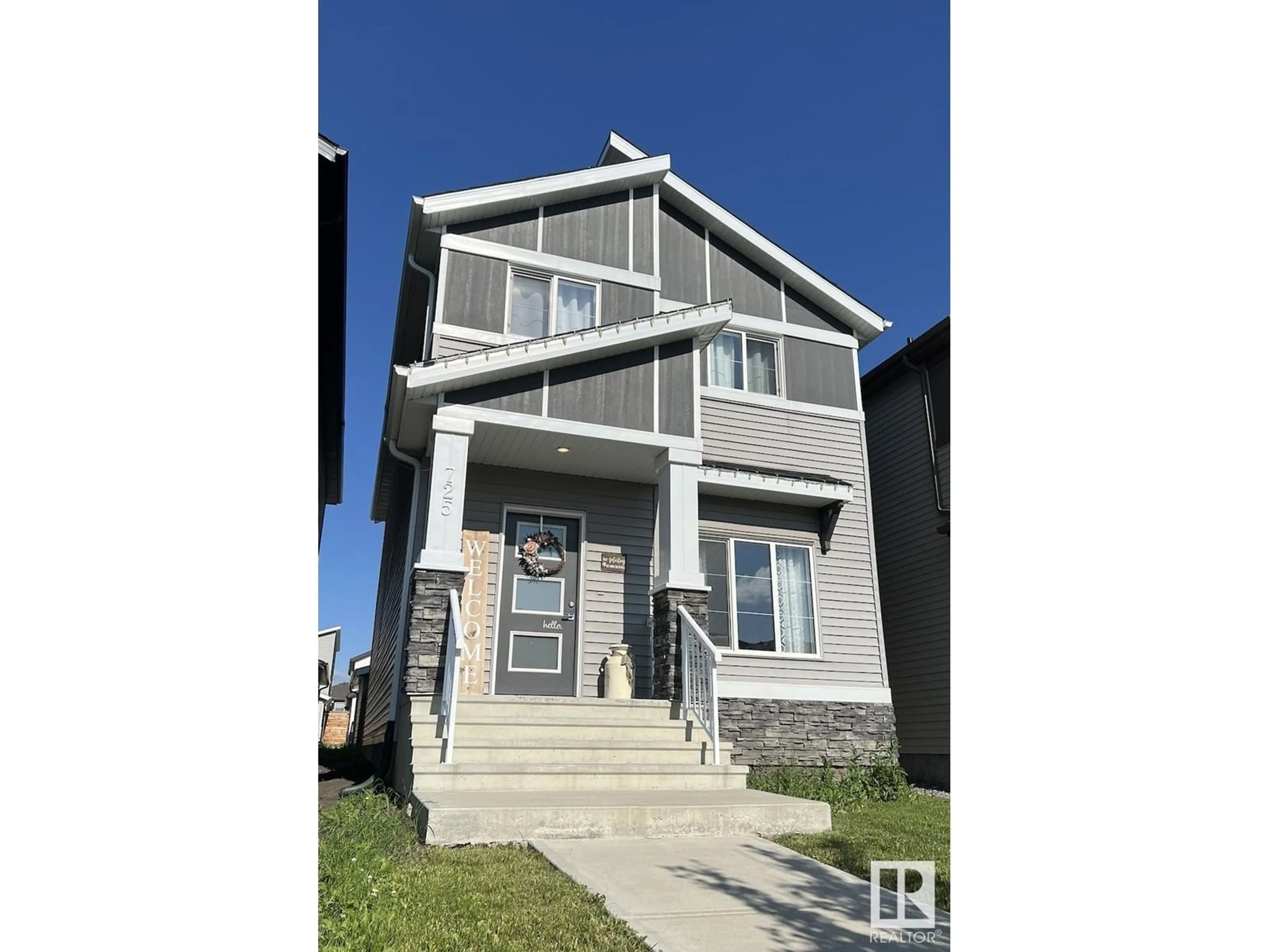 Home with vinyl exterior material, street for 725 BERG LO, Leduc Alberta T9E1G9