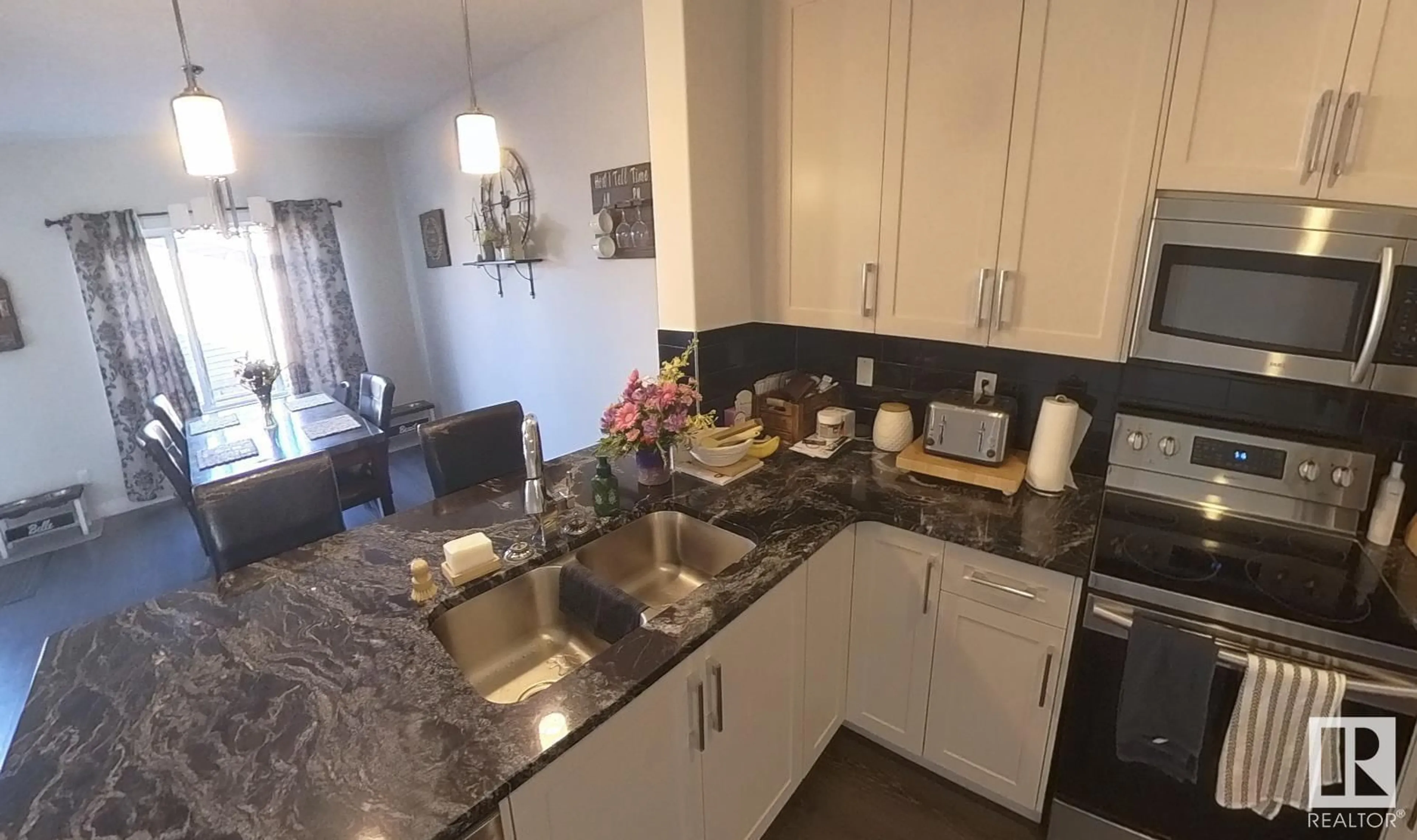 Open concept kitchen, ceramic/tile floor for 725 BERG LO, Leduc Alberta T9E1G9