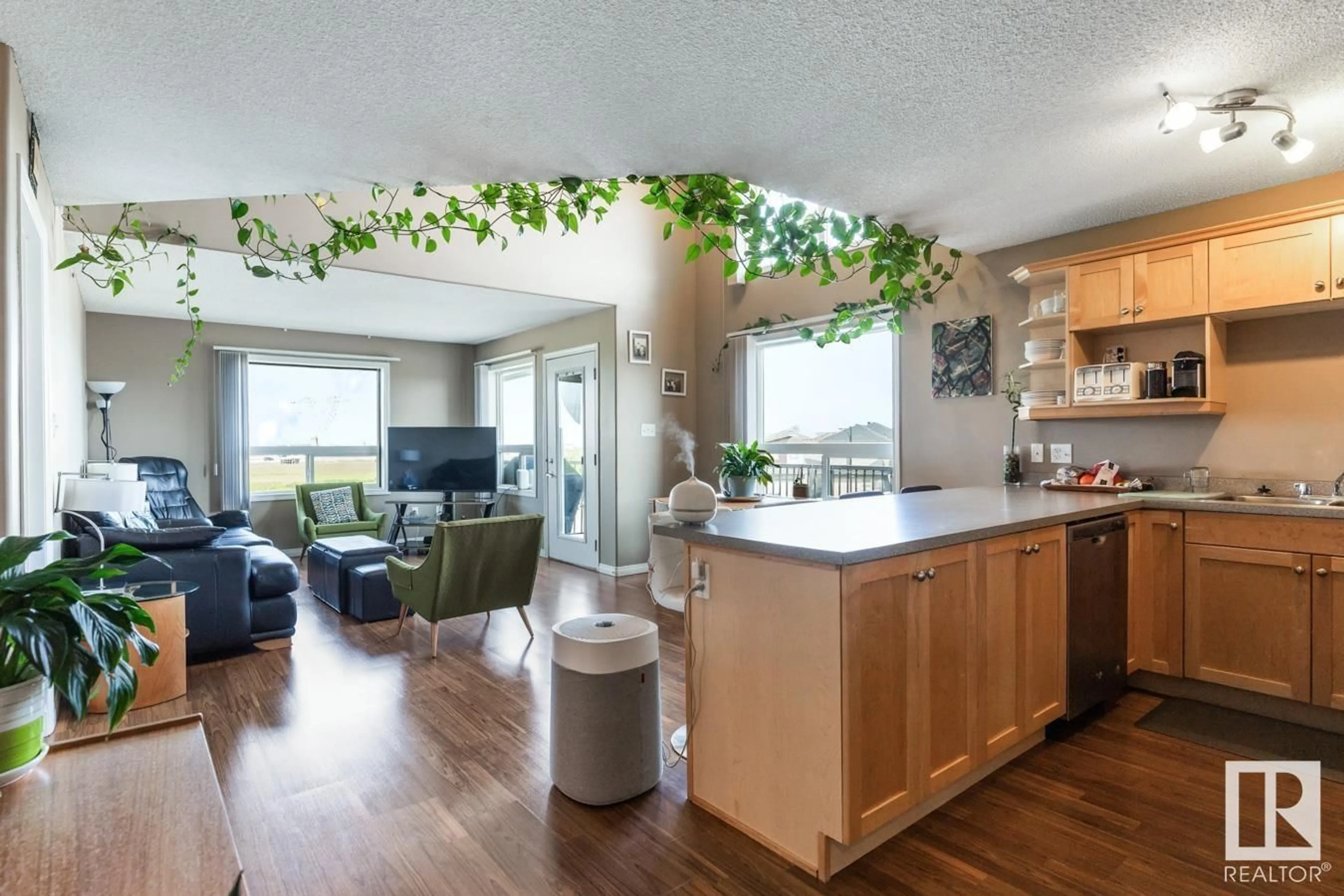 Open concept kitchen, wood/laminate floor for 9363 - 1325 SIMPSON DR, Edmonton Alberta T6R0N2