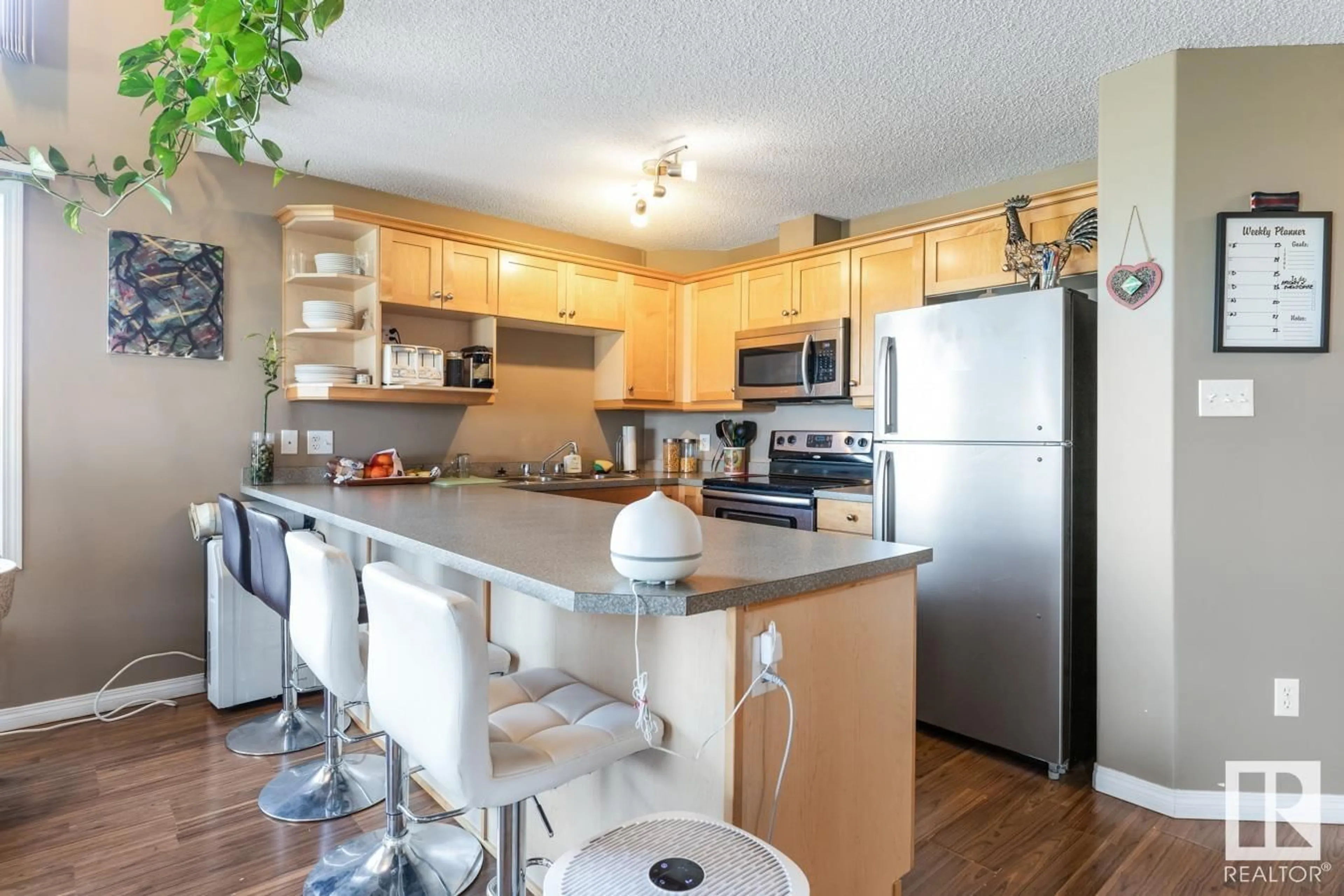 Standard kitchen, wood/laminate floor for 9363 - 1325 SIMPSON DR, Edmonton Alberta T6R0N2