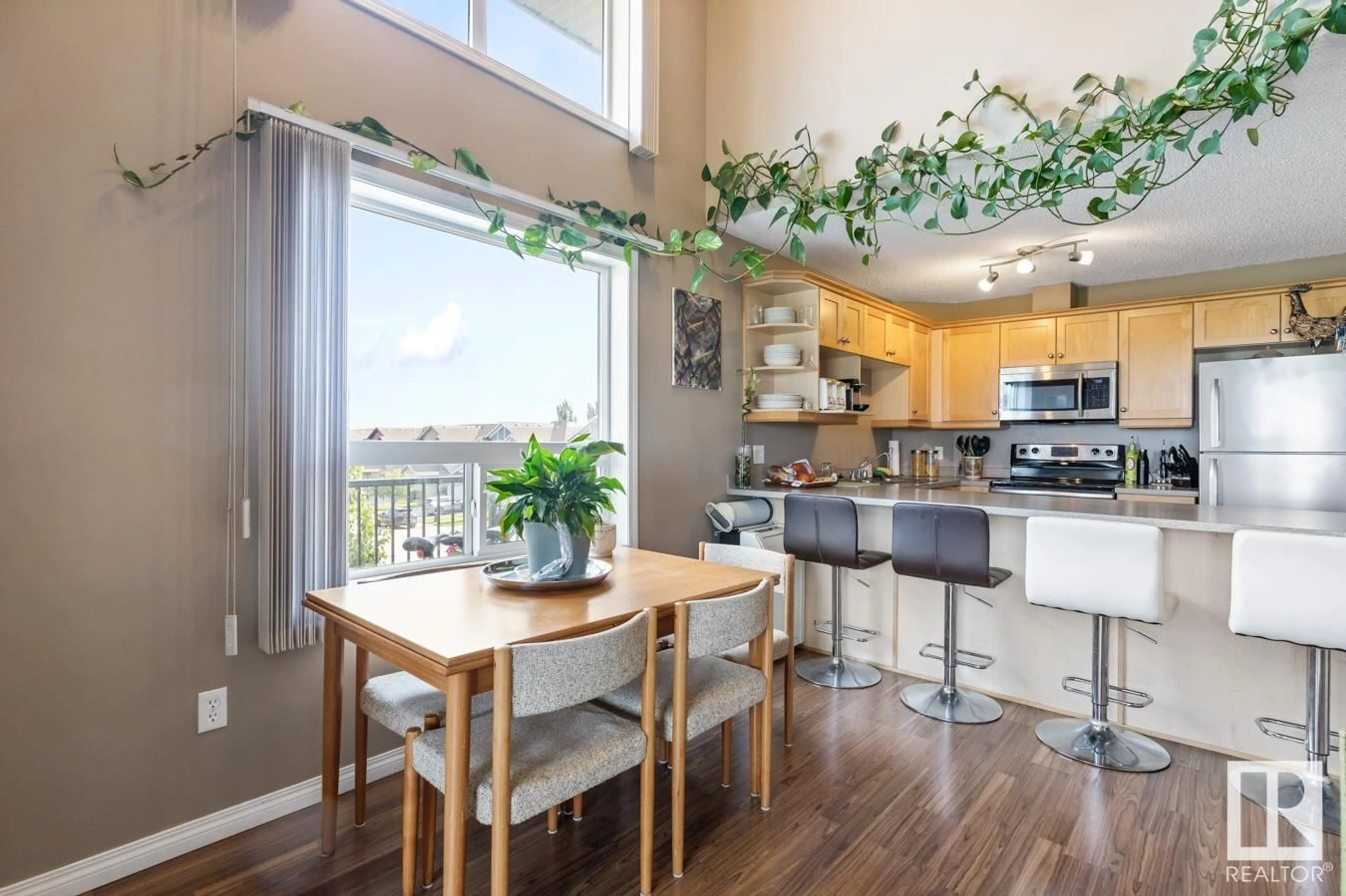 Open concept kitchen, wood/laminate floor for 9363 - 1325 SIMPSON DR, Edmonton Alberta T6R0N2
