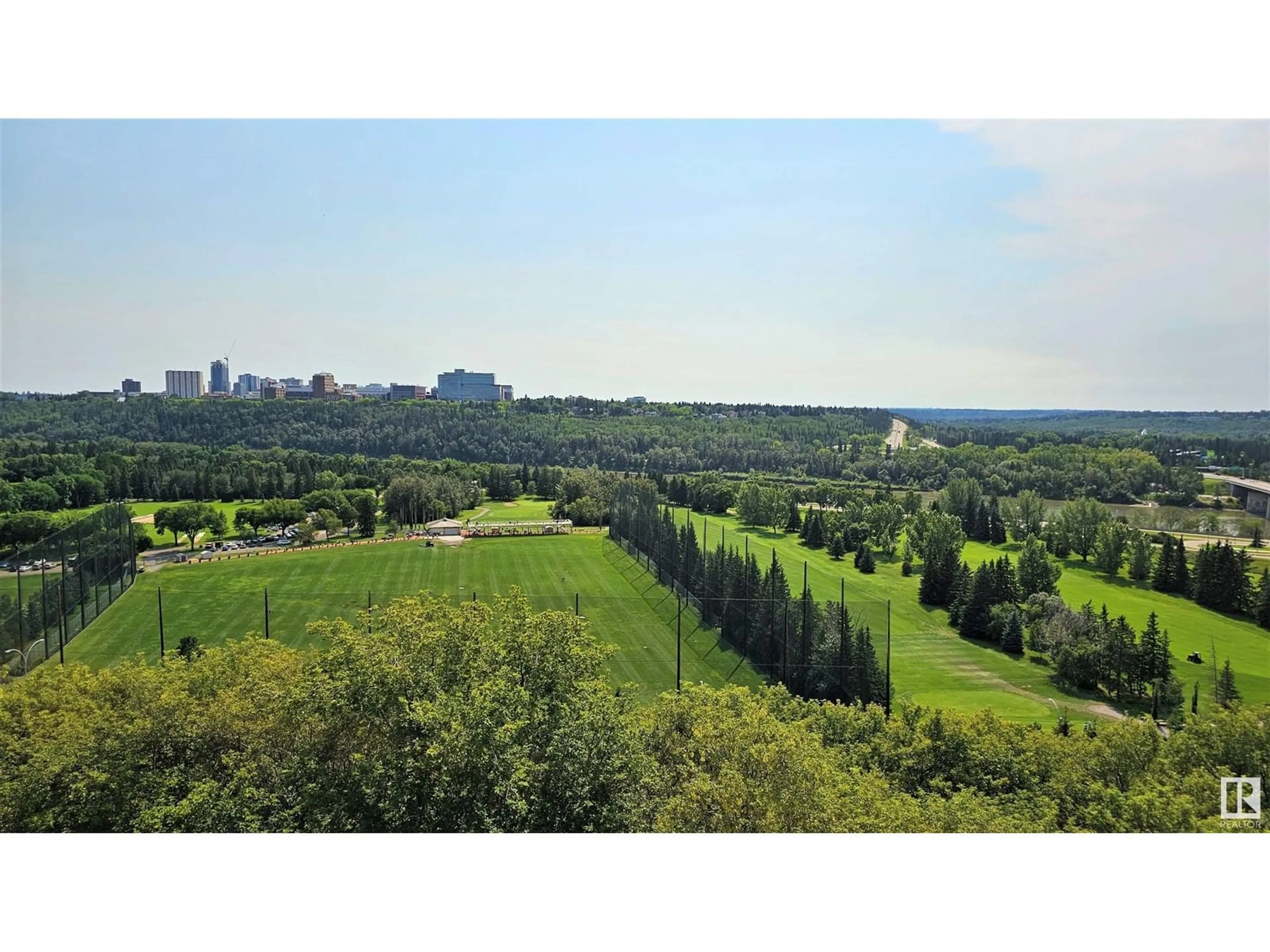 A pic from outside/outdoor area/front of a property/back of a property/a pic from drone, forest/trees view for #503 - 12207 JASPER AV, Edmonton Alberta T5N3K2