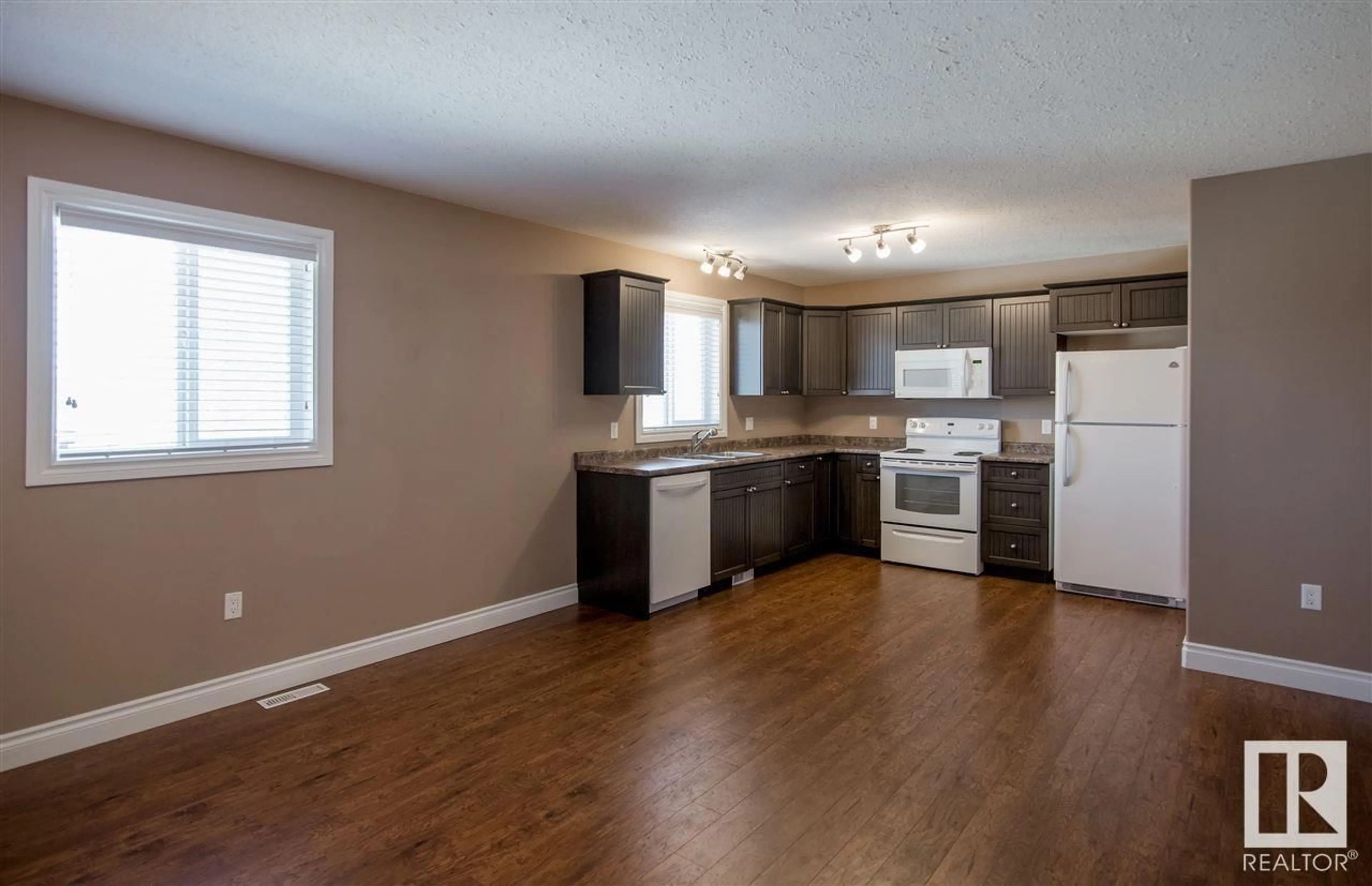 Open concept kitchen, wood/laminate floor for 5201 51 ST, Bonnyville Town Alberta T9N2G5