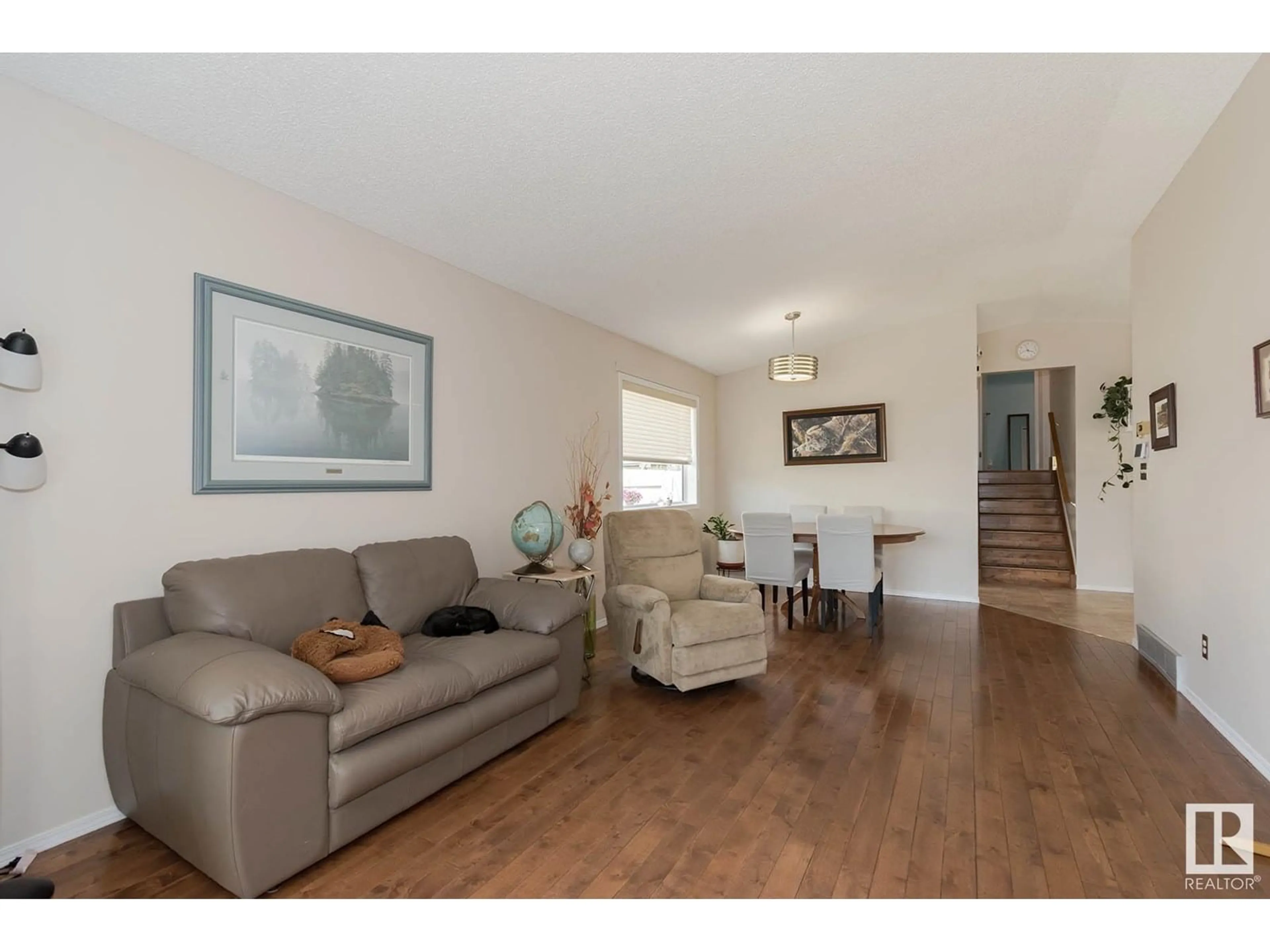 Living room with furniture, wood/laminate floor for 3315 43 ST, Edmonton Alberta T6L5Z6