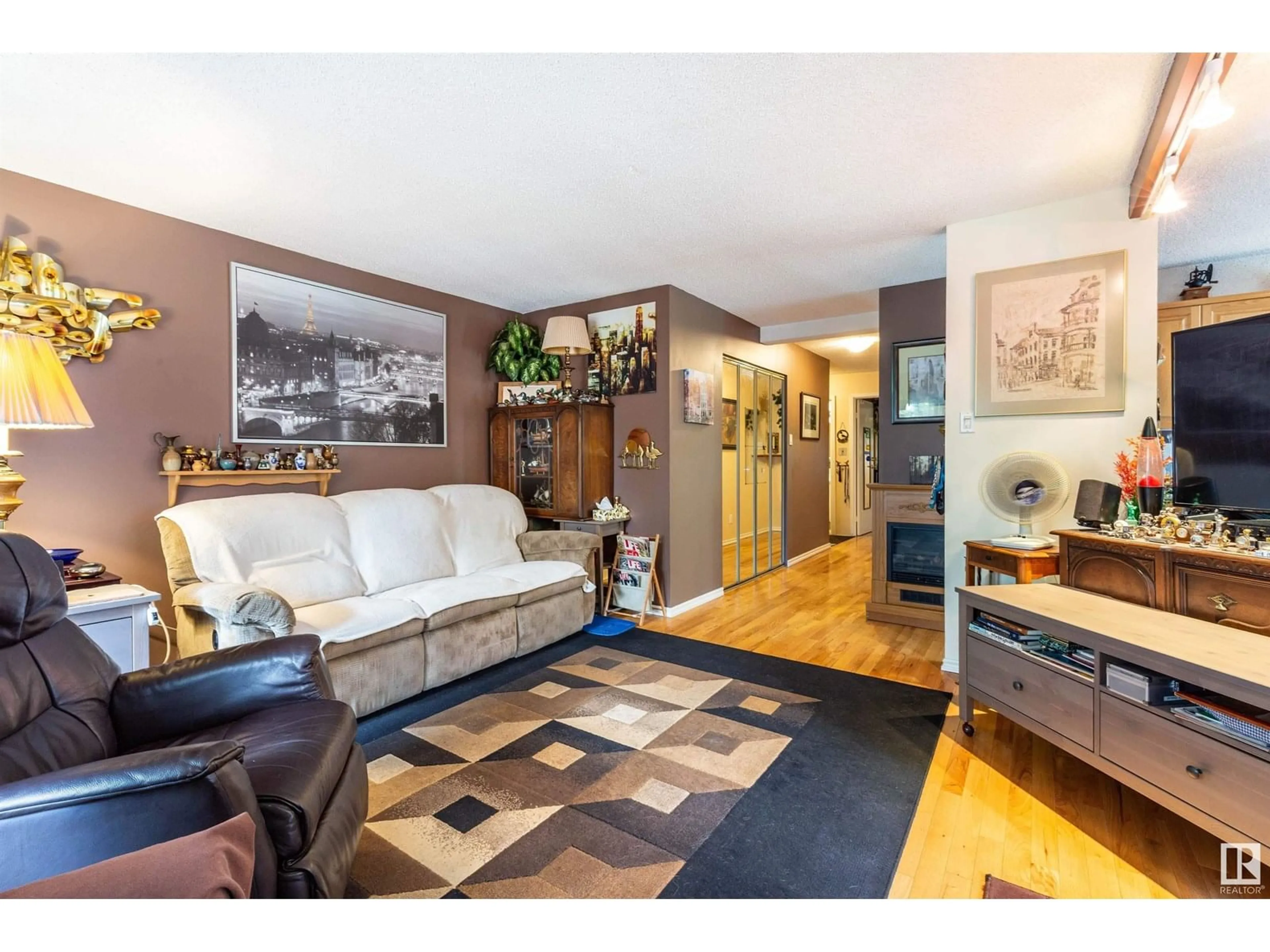 Living room with furniture, wood/laminate floor for #404 - 9929 113 ST, Edmonton Alberta T5K2N9