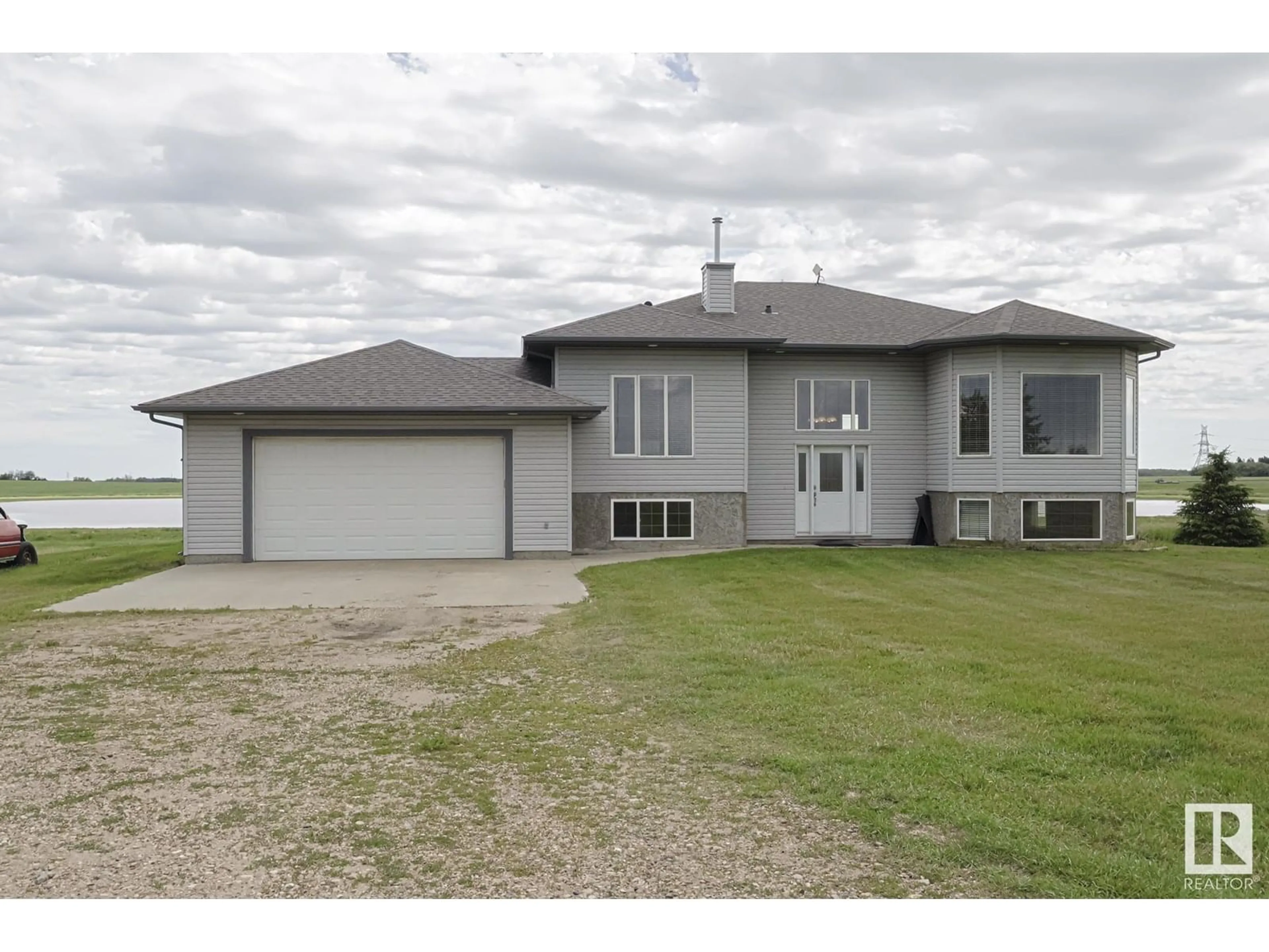 A pic from outside/outdoor area/front of a property/back of a property/a pic from drone, water/lake/river/ocean view for 55415 HWY 28 A, Rural Sturgeon County Alberta T0A1N1