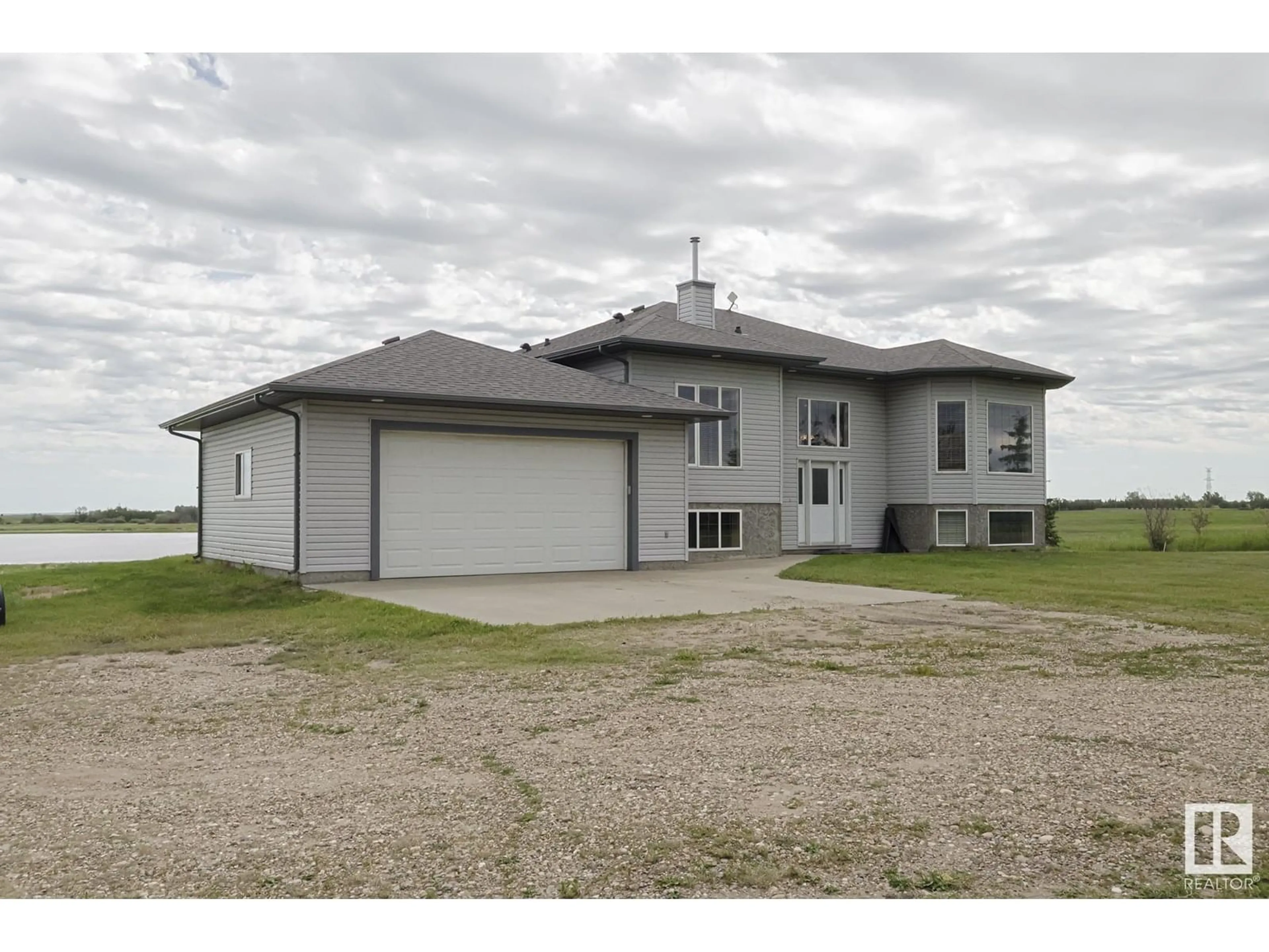 A pic from outside/outdoor area/front of a property/back of a property/a pic from drone, building for 55415 HWY 28 A, Rural Sturgeon County Alberta T0A1N1