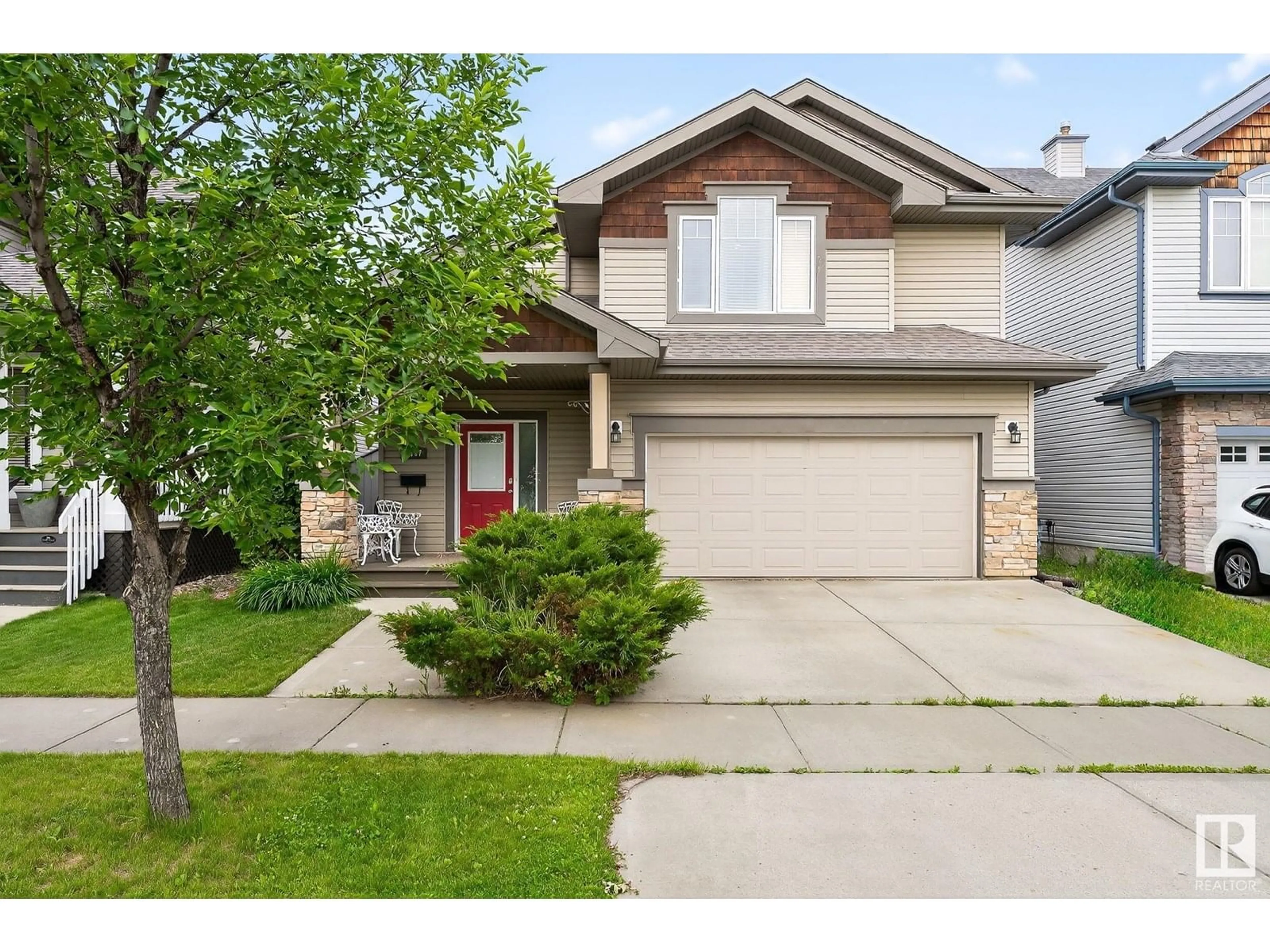 Home with vinyl exterior material, street for 5447 THIBAULT WD, Edmonton Alberta T6R3P9