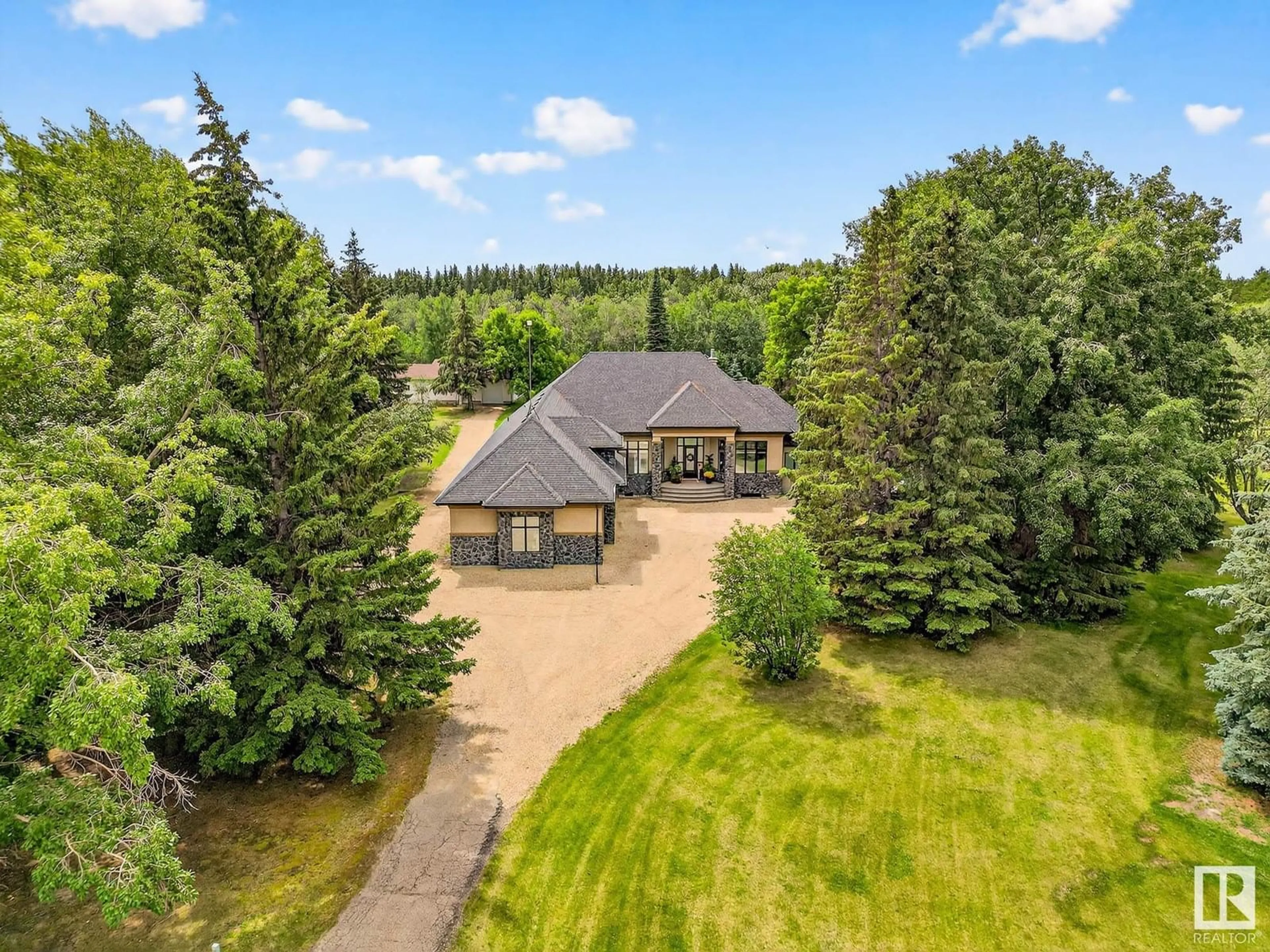 A pic from outside/outdoor area/front of a property/back of a property/a pic from drone, unknown for 131 24203 TWP ROAD 554, Rural Sturgeon County Alberta T8T1X9