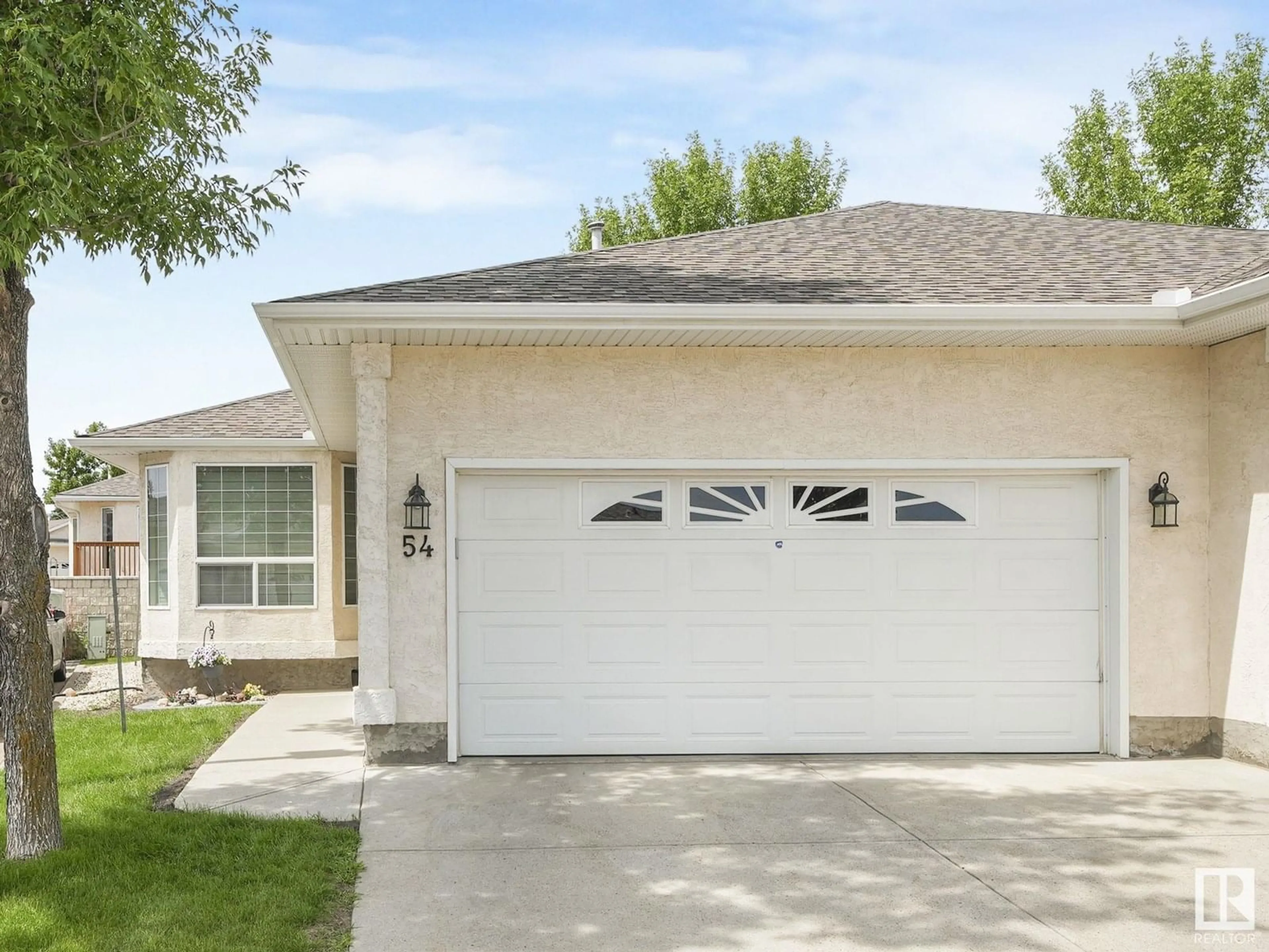 Home with vinyl exterior material, street for NW - 54 14428 MILLER BV, Edmonton Alberta T5Y2Y6