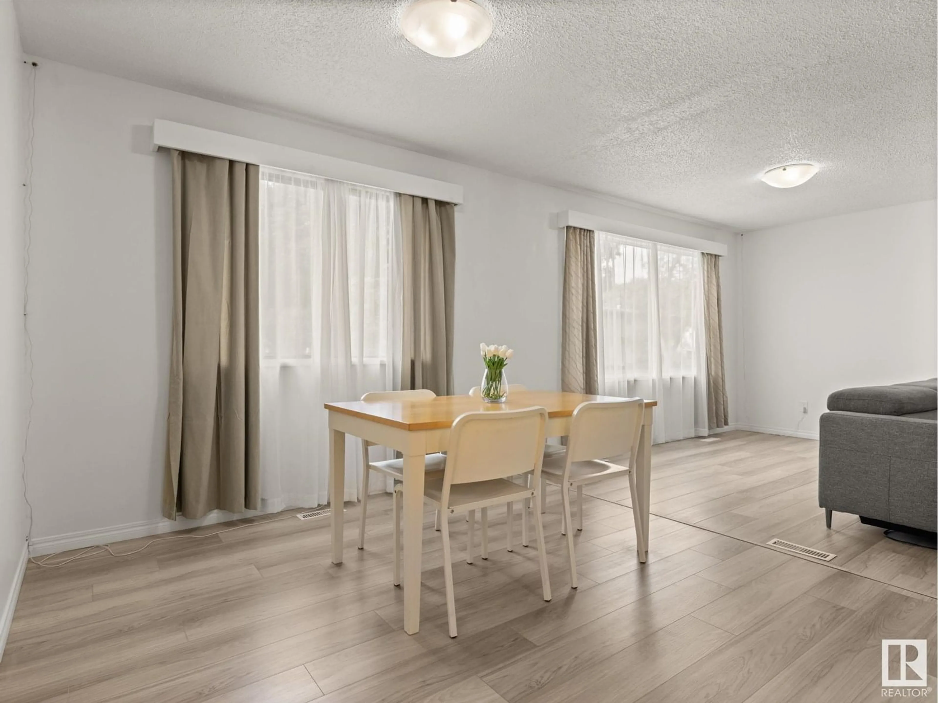 Dining room, wood/laminate floor for 6003 122 AV, Edmonton Alberta T5W4X2