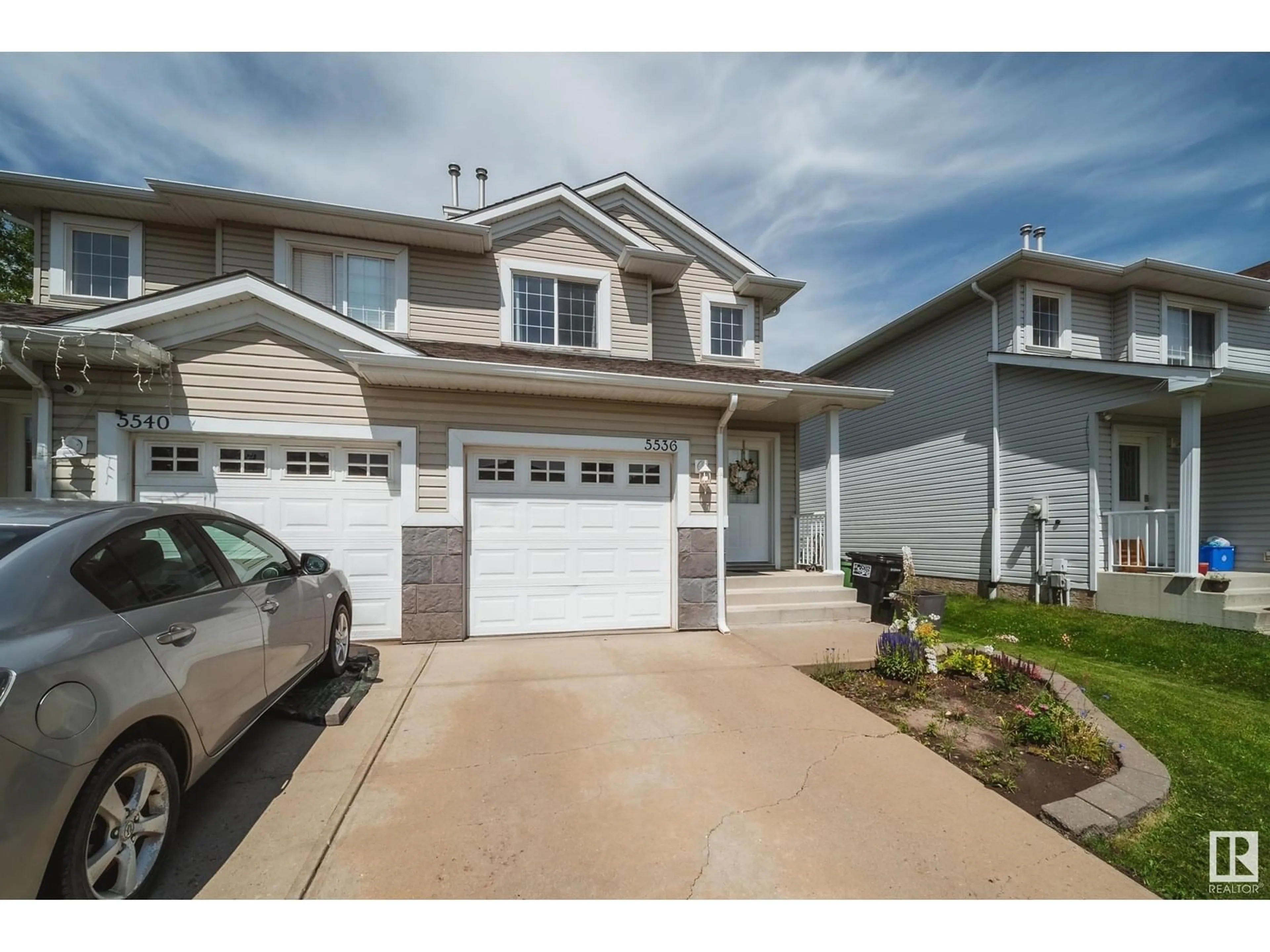 Home with vinyl exterior material, street for 5536 163 AV, Edmonton Alberta T5Y3L3