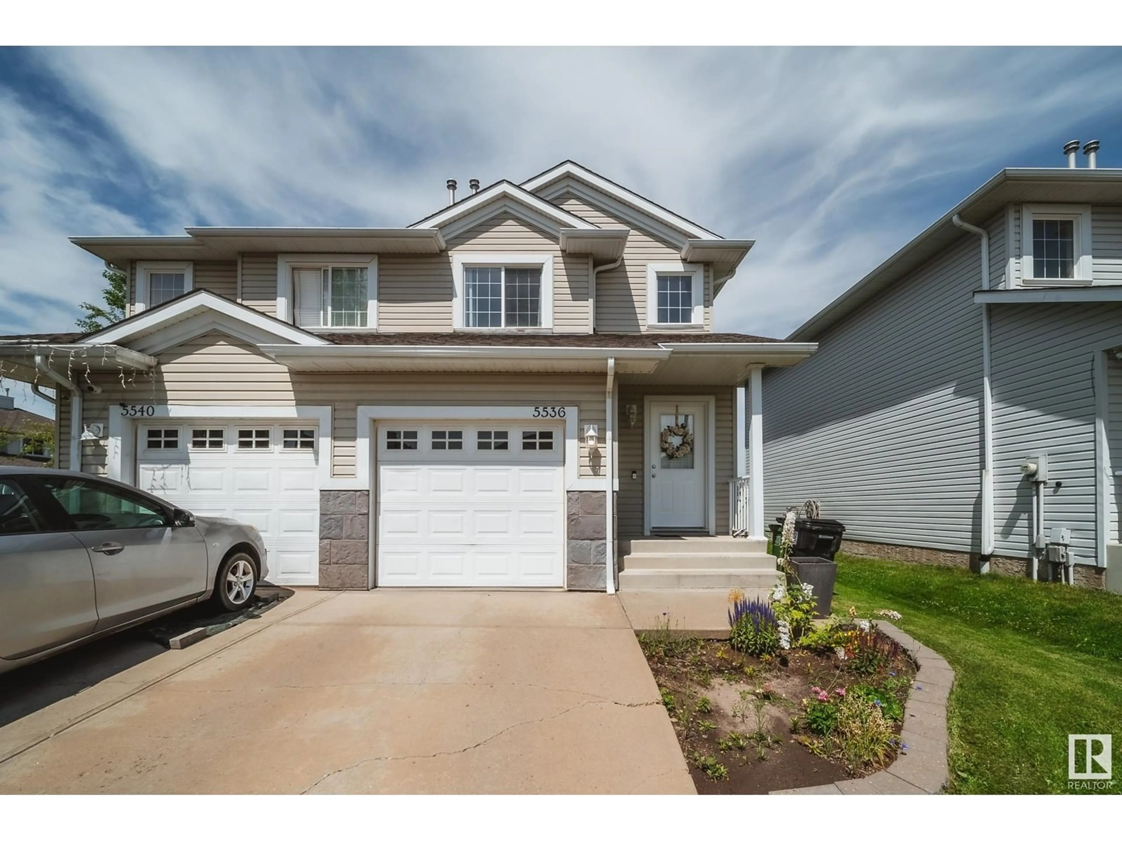 Home with vinyl exterior material, street for 5536 163 AV, Edmonton Alberta T5Y3L3
