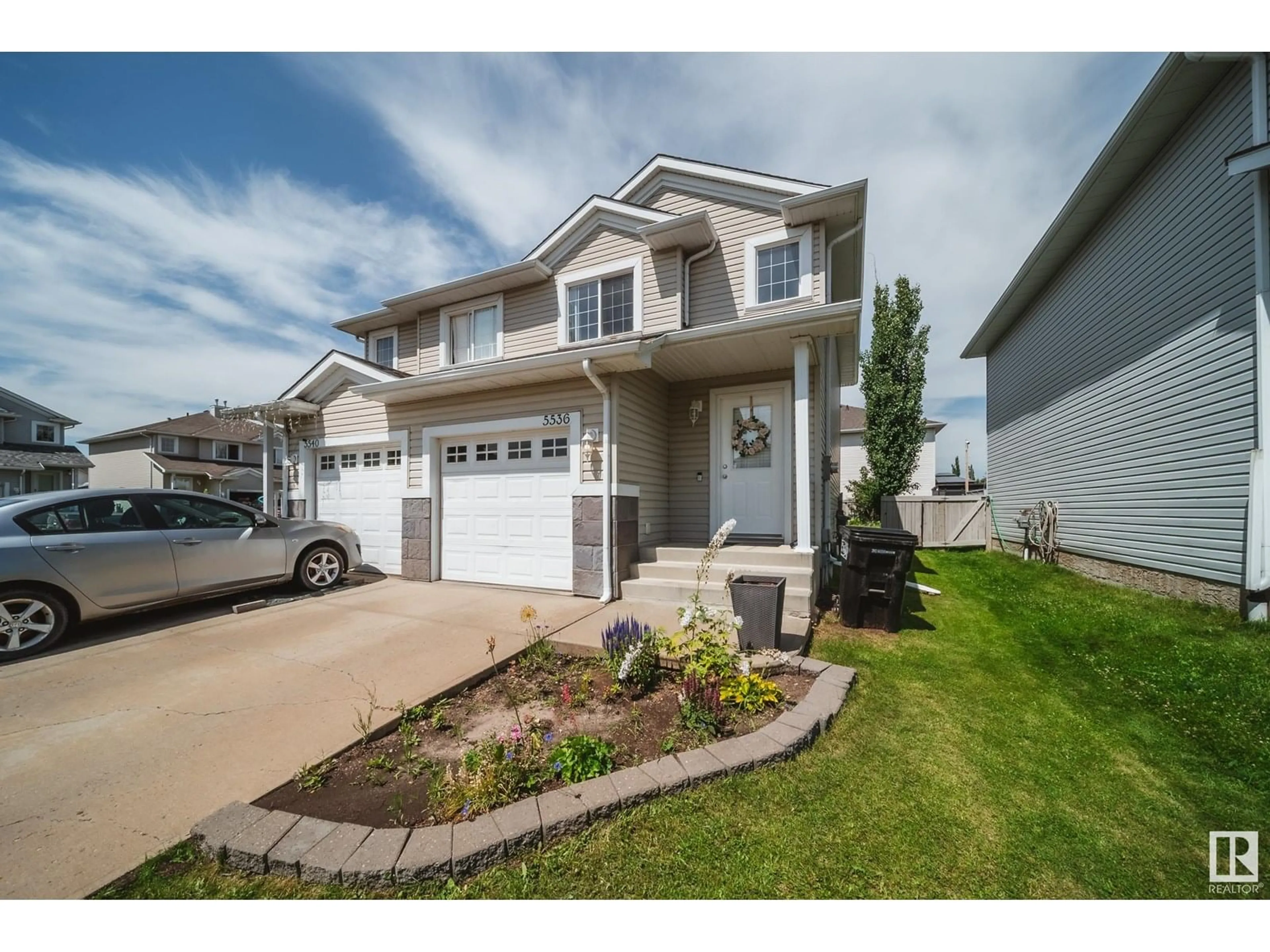 Home with vinyl exterior material, street for 5536 163 AV, Edmonton Alberta T5Y3L3