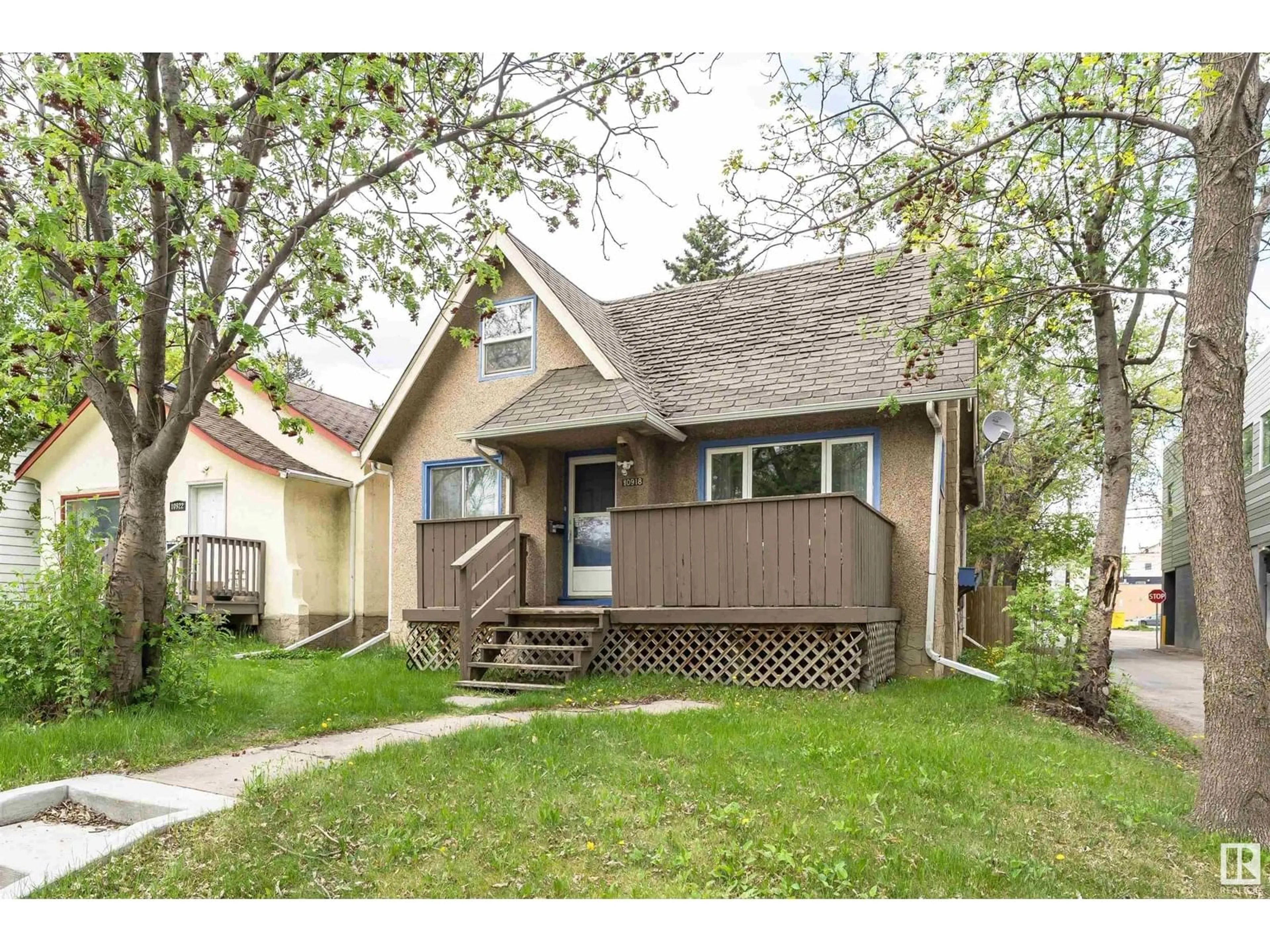 Home with vinyl exterior material, street for 10918 84 AV, Edmonton Alberta T6G0V4