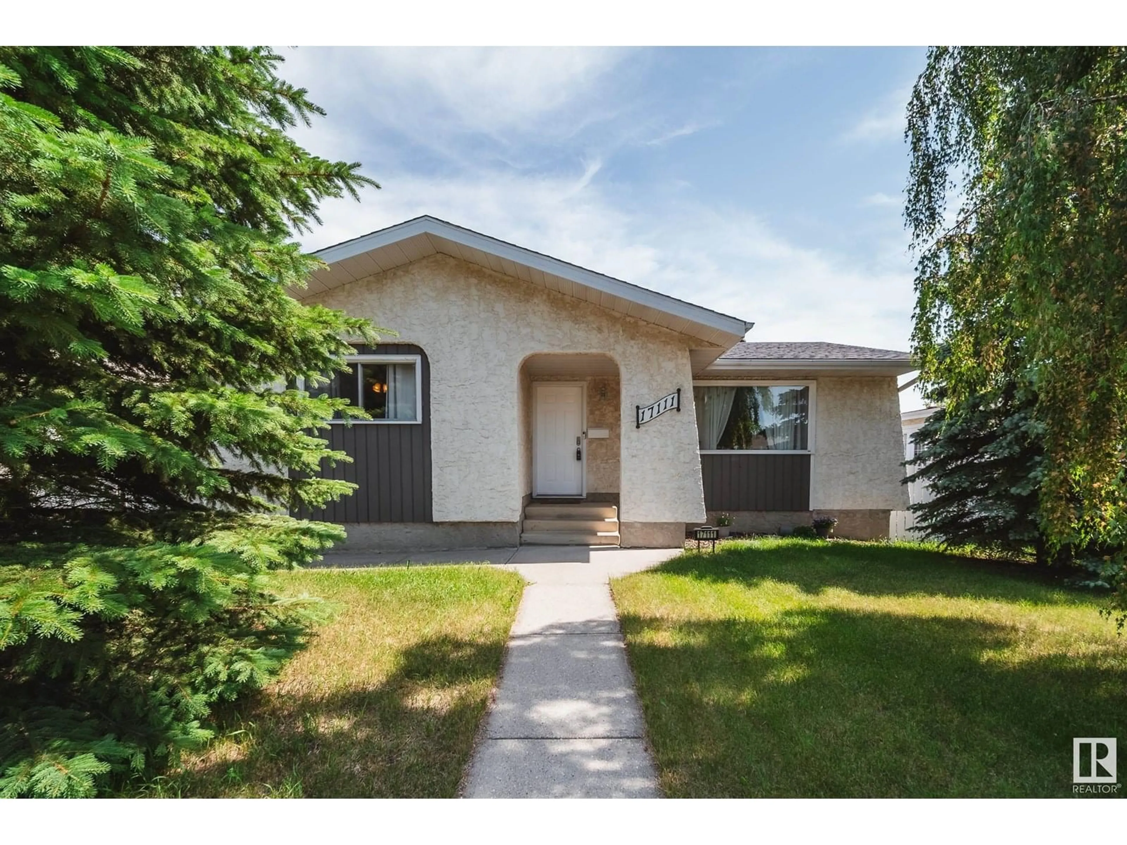 Home with vinyl exterior material, street for 17111 110 ST, Edmonton Alberta T5X3B4