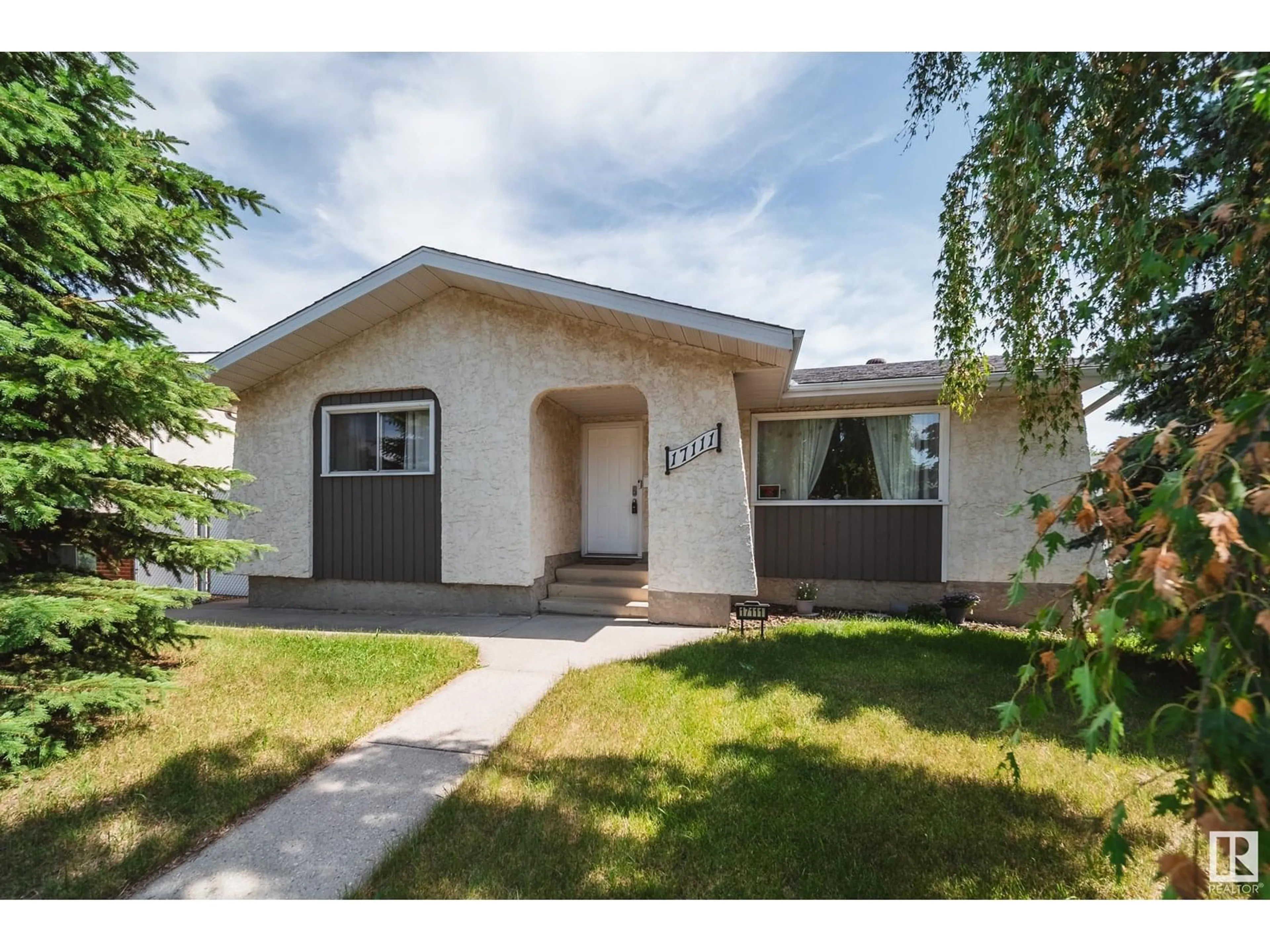 Home with vinyl exterior material, street for 17111 110 ST, Edmonton Alberta T5X3B4