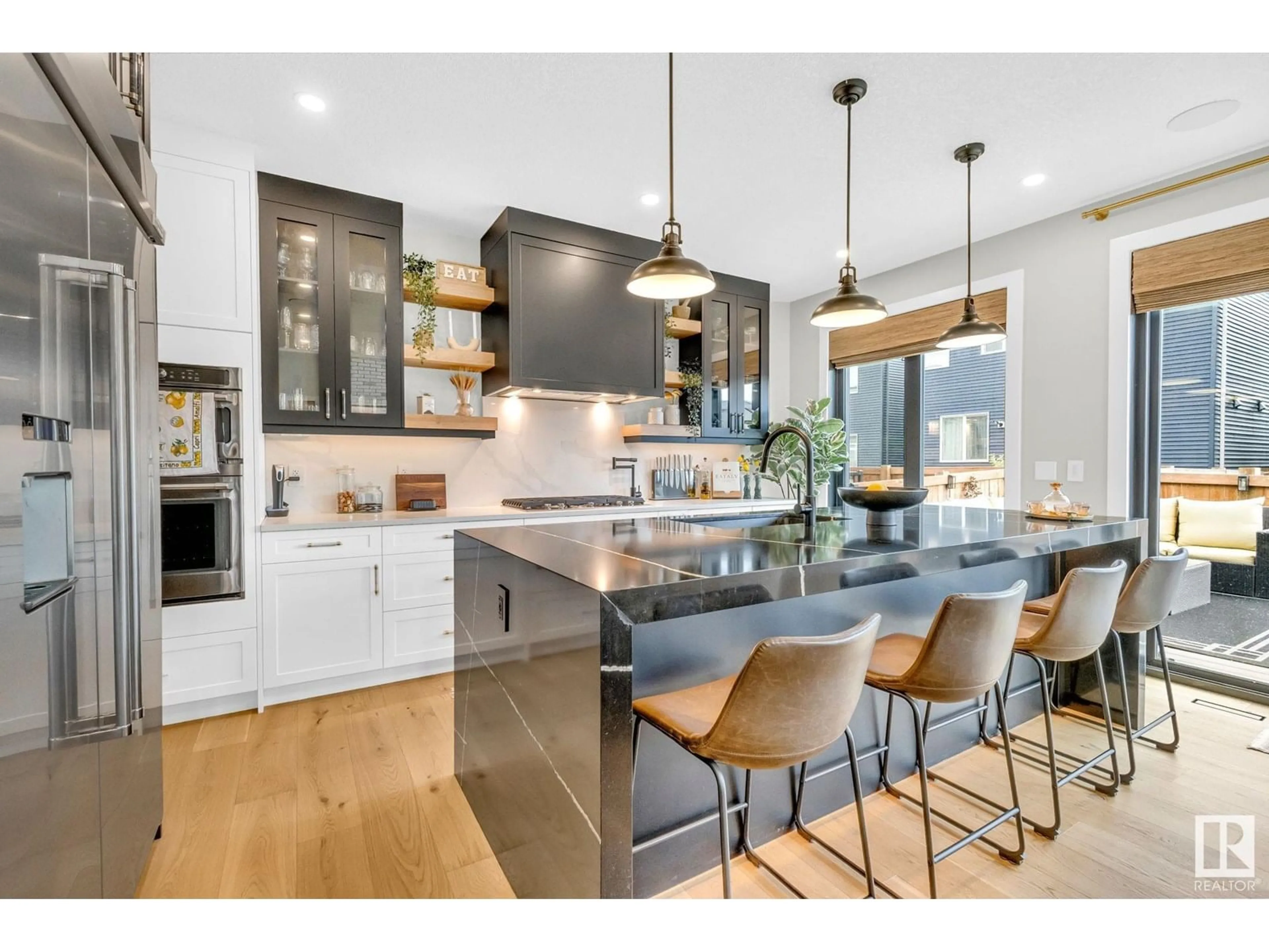 Open concept kitchen, wood/laminate floor for 5548 KOOTOOK DR, Edmonton Alberta T6W4W1