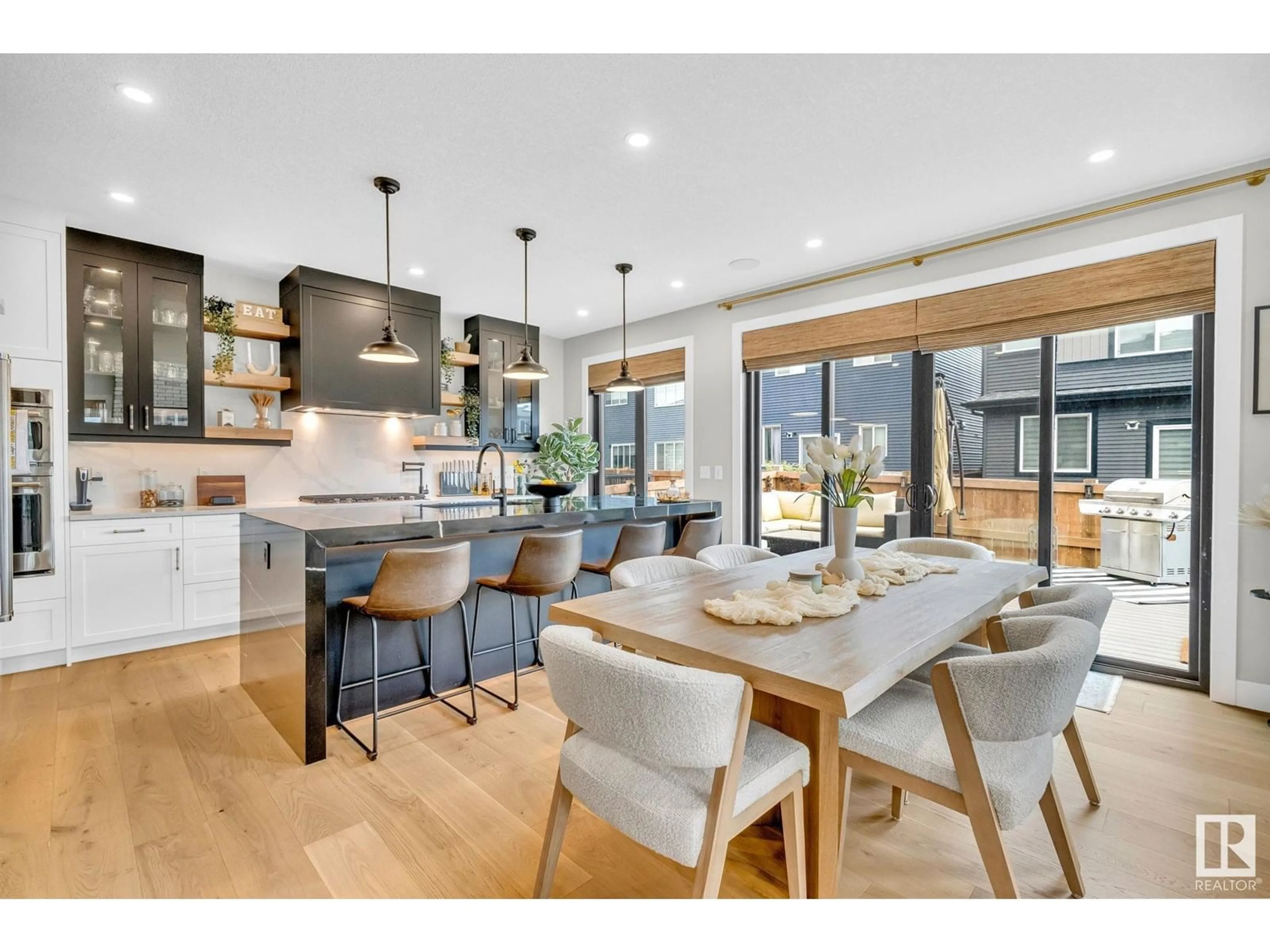 Open concept kitchen, wood/laminate floor for 5548 KOOTOOK DR, Edmonton Alberta T6W4W1